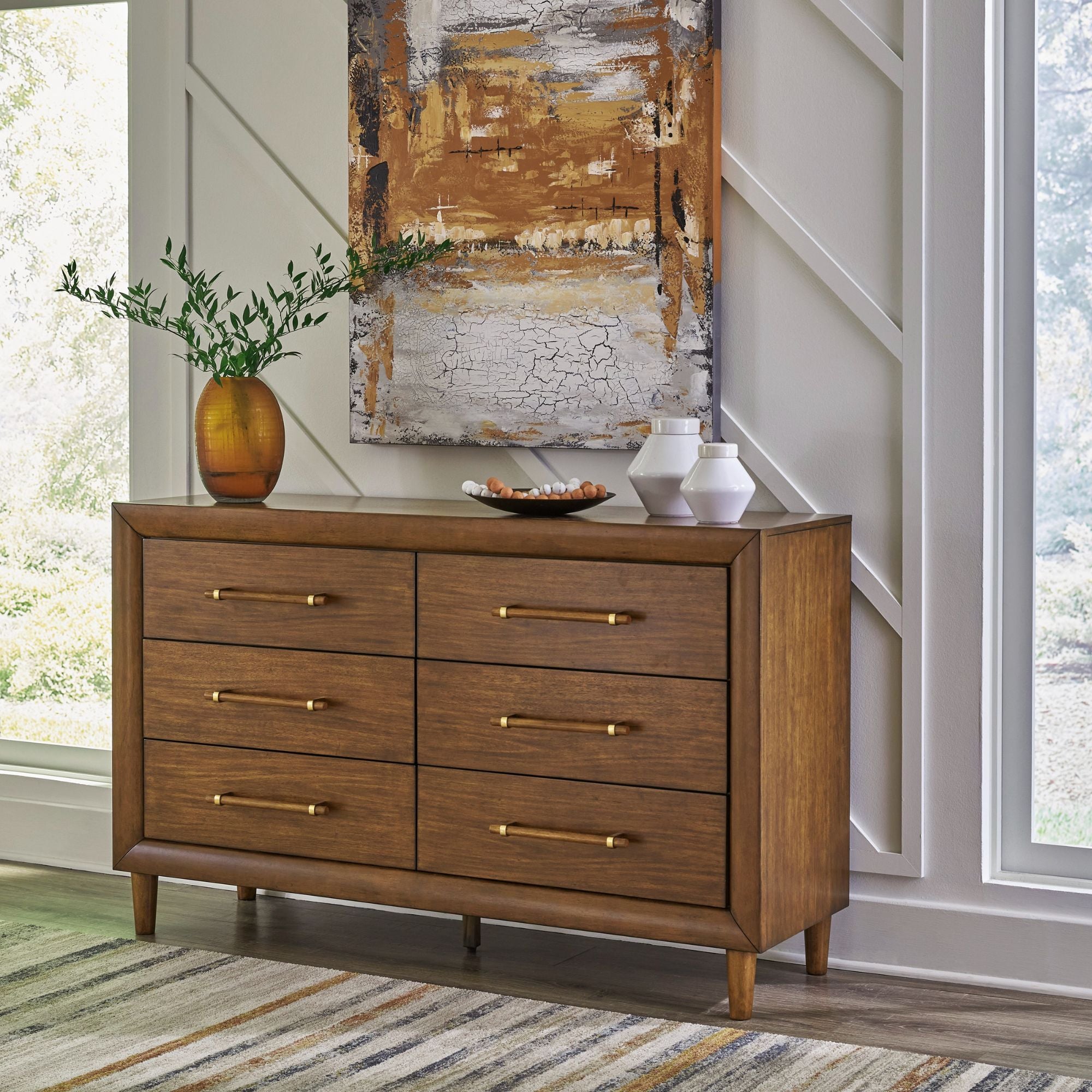 Signature Ashley Lyncott dresser with sleek wood finish and modern design, featuring multiple drawers for ample storage.