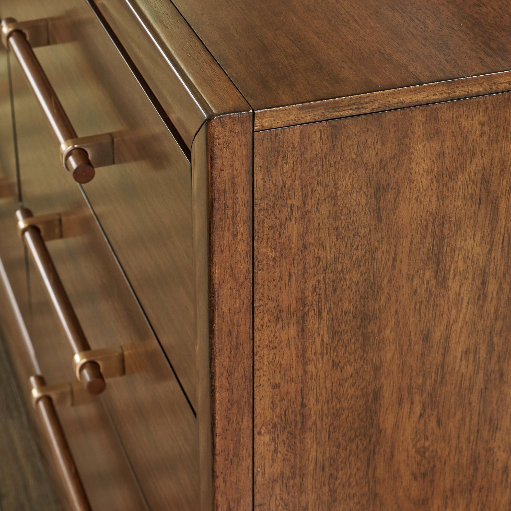 Signature Ashley Lyncott dresser with sleek wooden finish and modern design featuring multiple drawers for ample storage.
