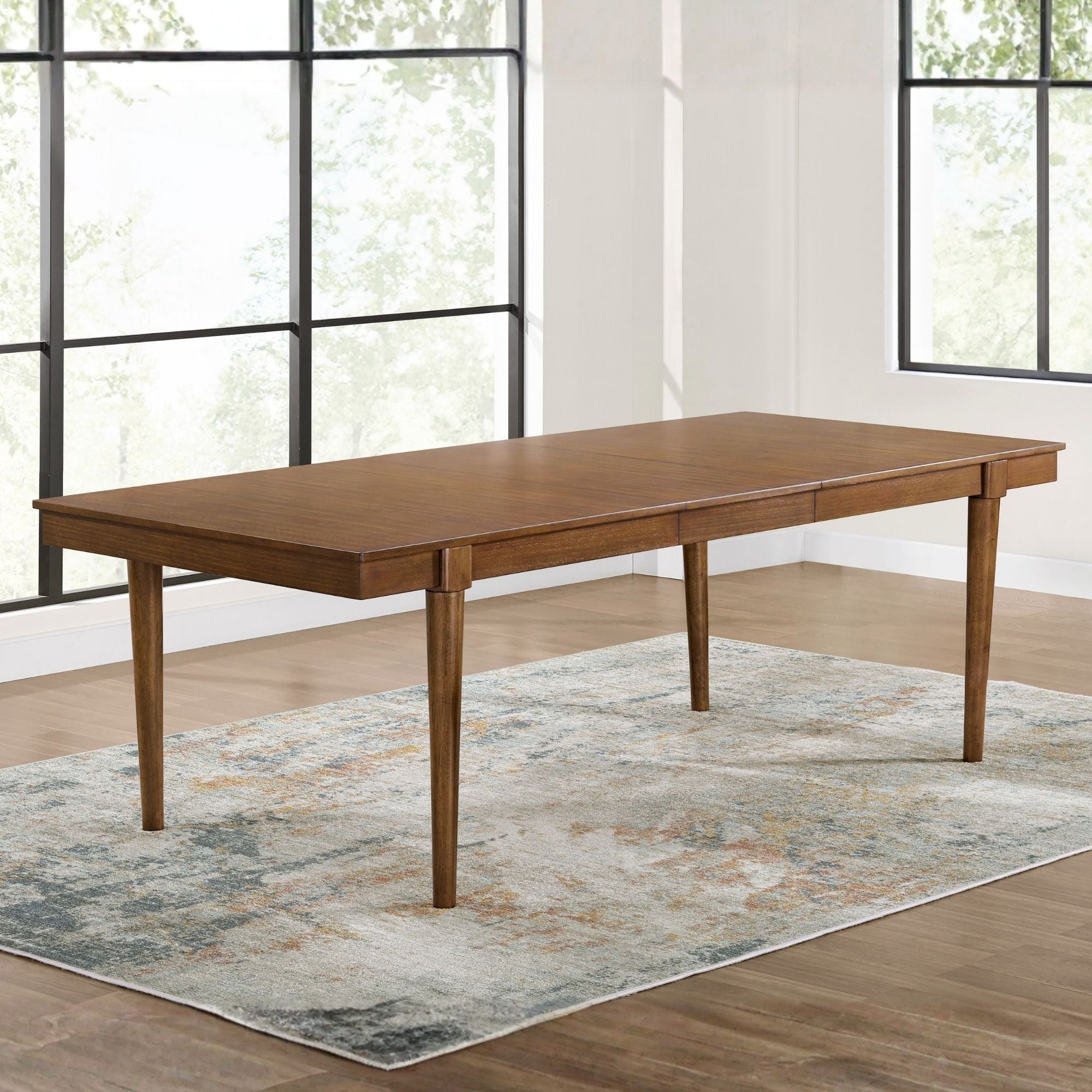 Lyncott Extendable Dining Room Table by Signature Ashley with a polished wooden surface and sturdy legs, ideal for family meals.