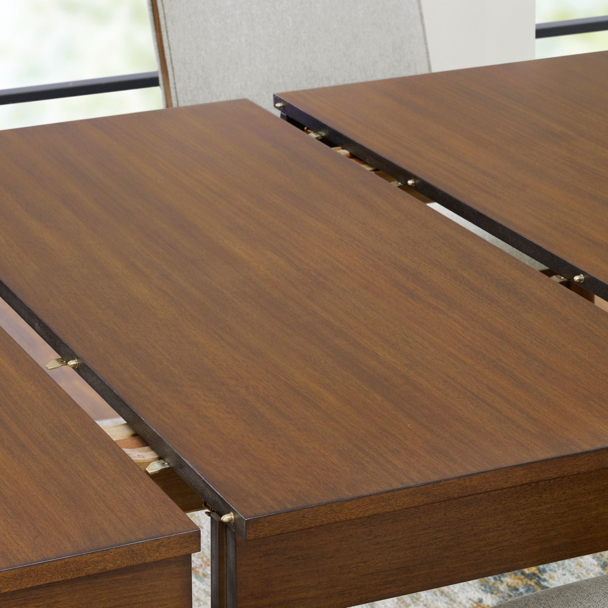 Lyncott extendable dining room table by Signature Ashley with a wooden finish and modern design, shown with extended leaves.