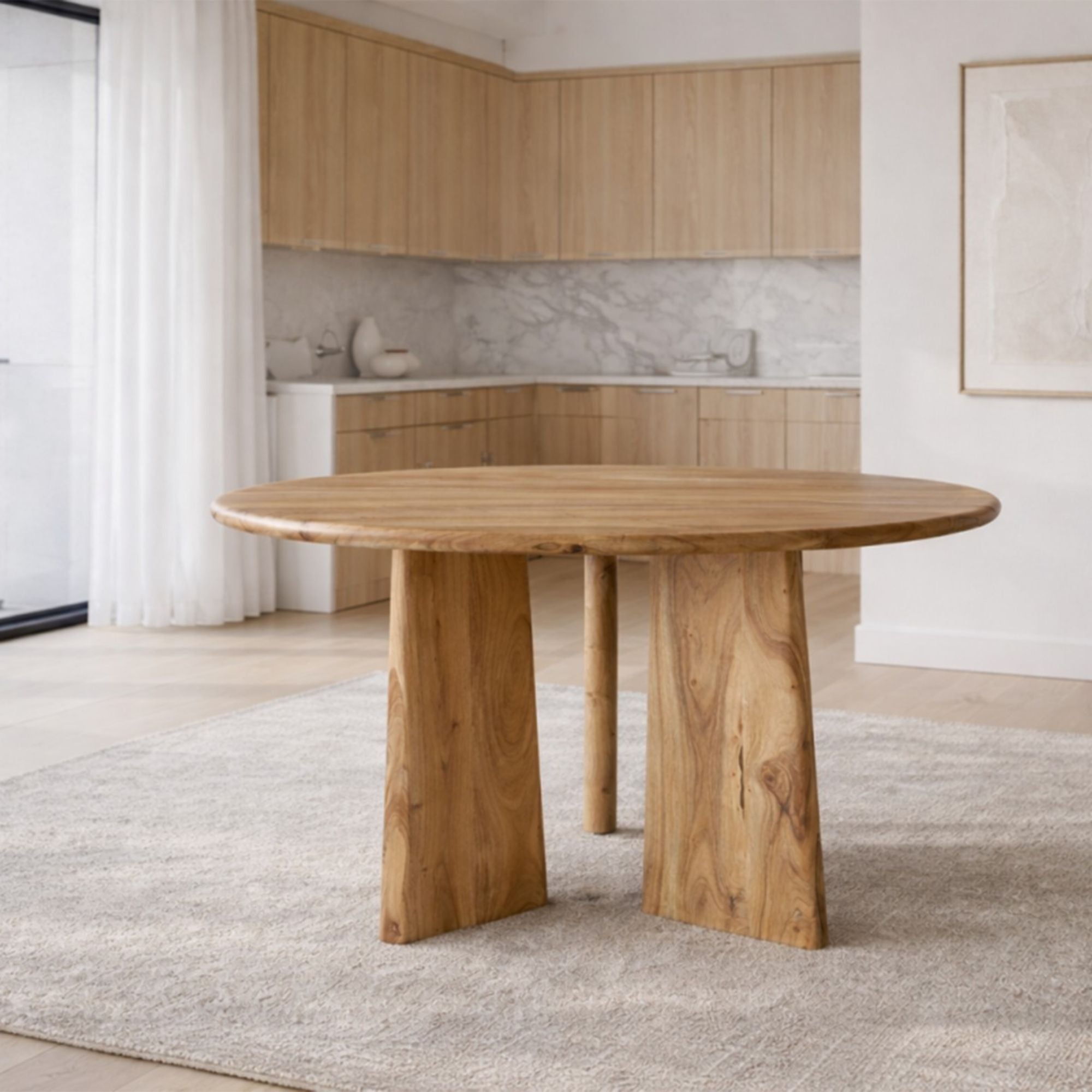 Brassex Felix mango wood round dining table with natural oak finish, showcasing a smooth, polished surface and sturdy wooden legs.