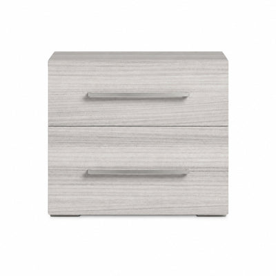 Modern Italian Mia night stand by Status Italia, showing sleek wood surface and minimalist design from a side angle.
