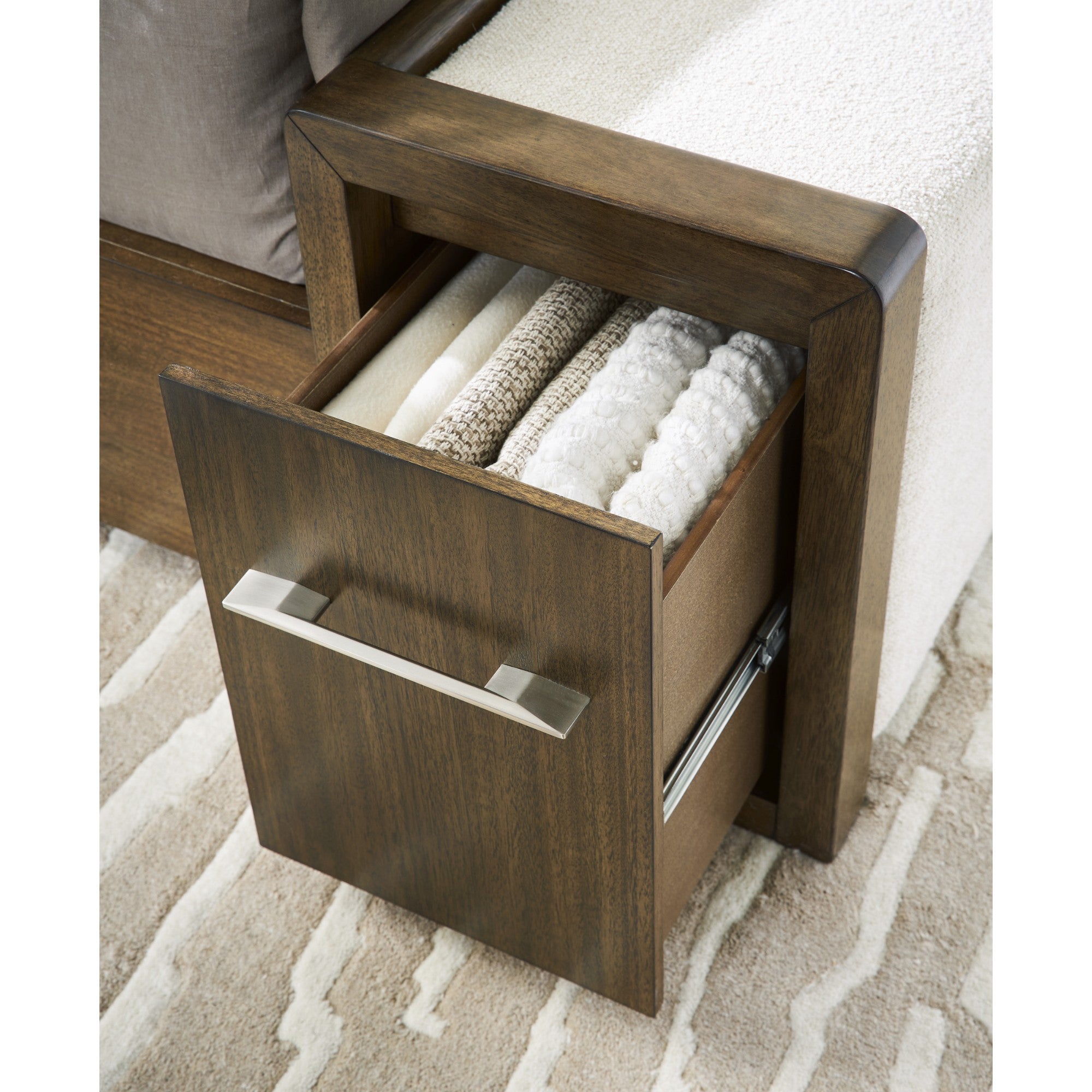 Signature Ashley Marxmore upholstered storage bed with a plush headboard and built-in drawers for bedroom organization.