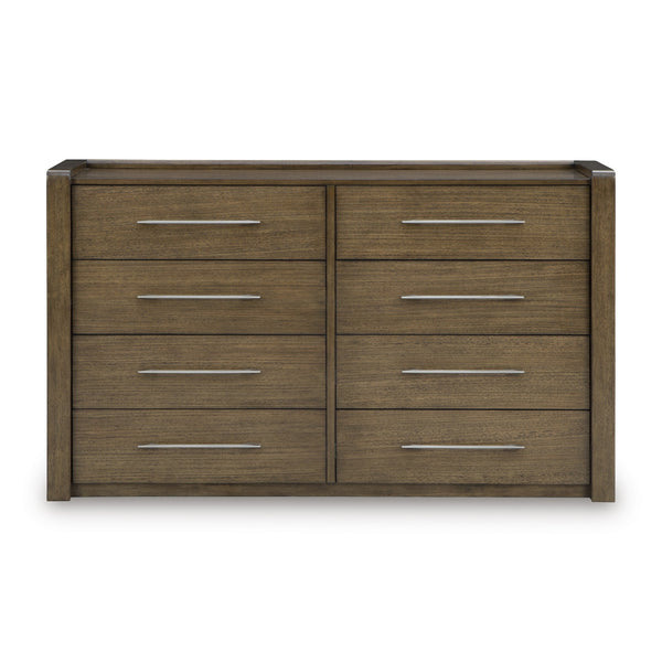Signature Ashley Marxmore upholstered storage bed with a padded headboard and built-in storage drawers in a modern bedroom setting.