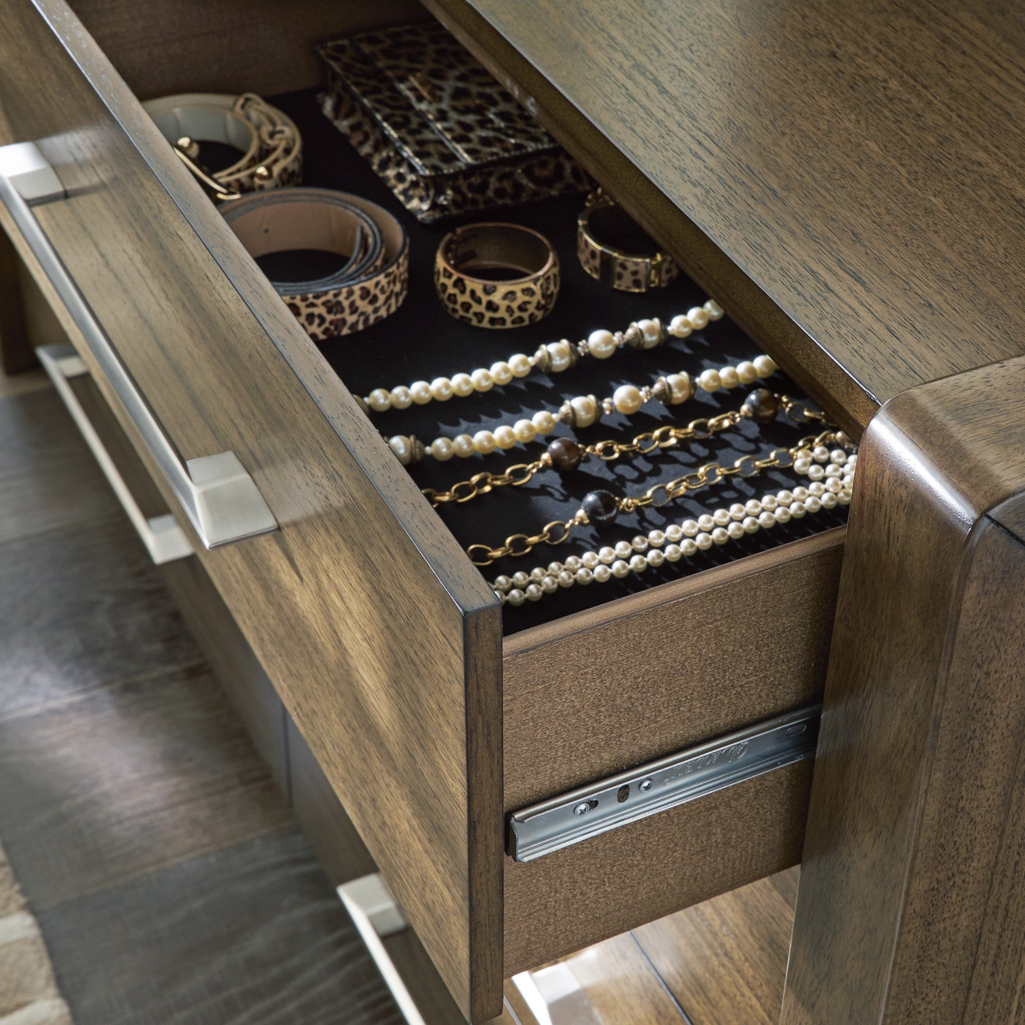 Signature Ashley Marxmore upholstered storage bed with a padded headboard and built-in drawers for bedroom organization.