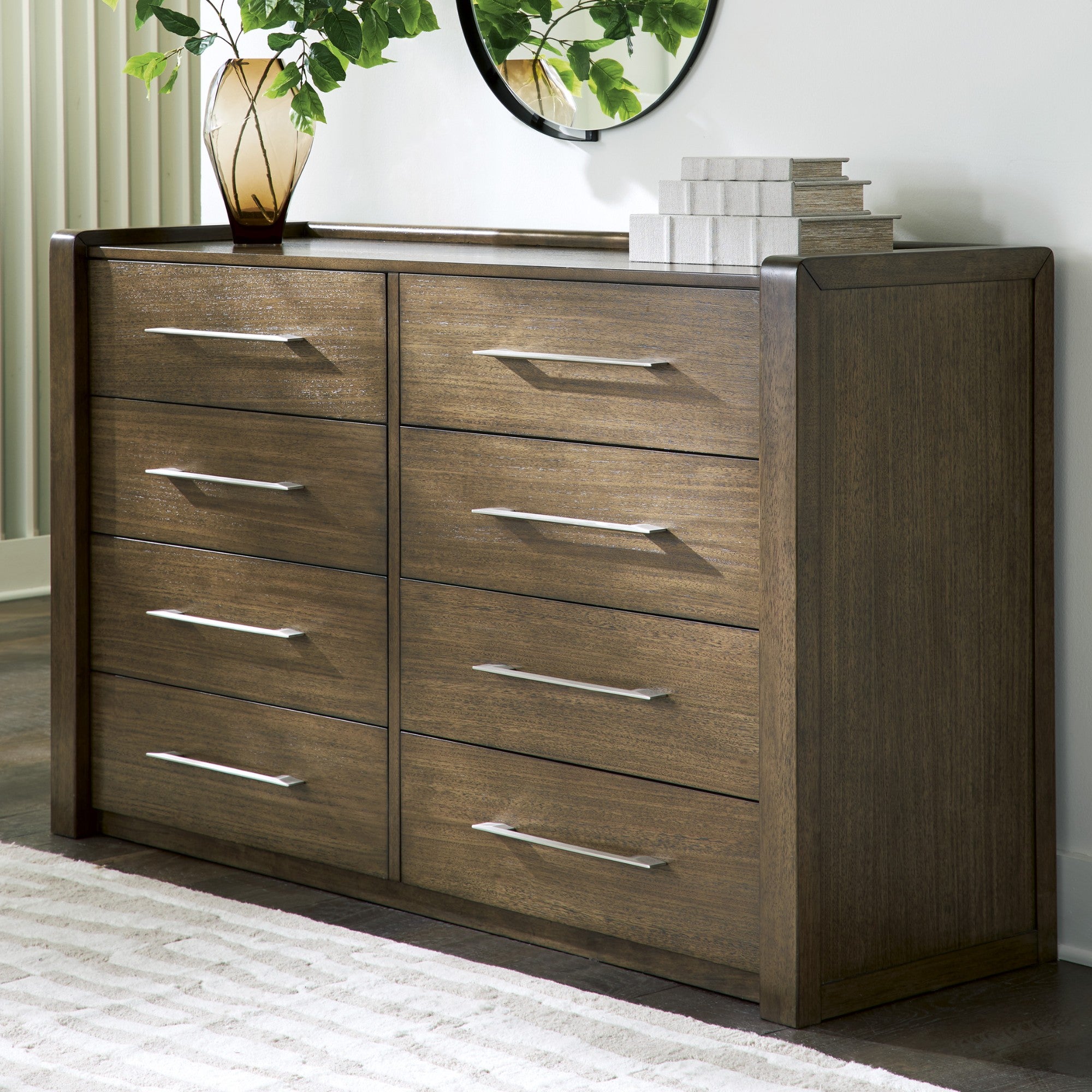 Ashley Marxmore upholstered storage bed in a bedroom setting, featuring a padded headboard and built-in storage drawers.