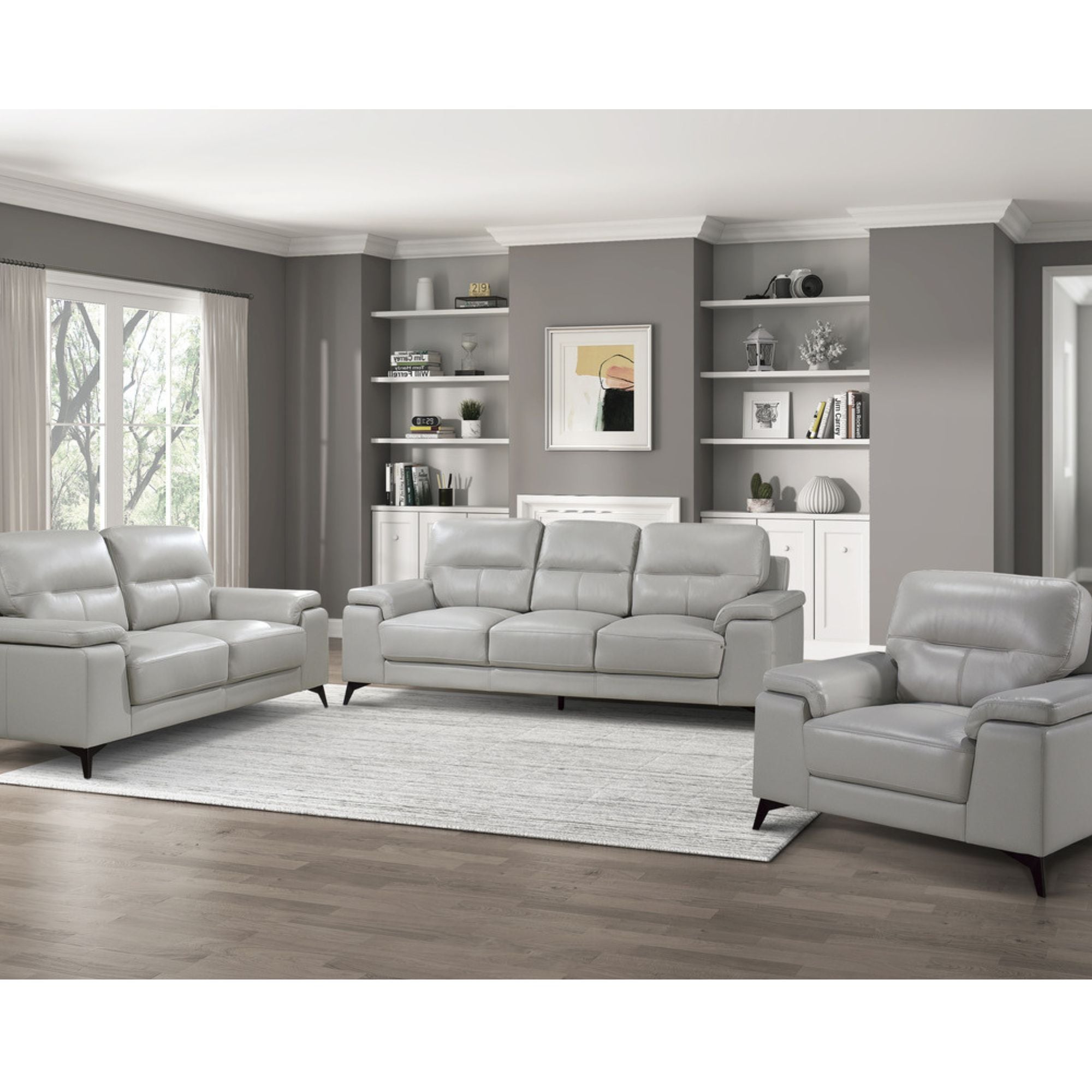 Light grey Mischa leather sofa by MAZ, showcasing a modern, plush seating with sleek design and clean lines in a living room setting.