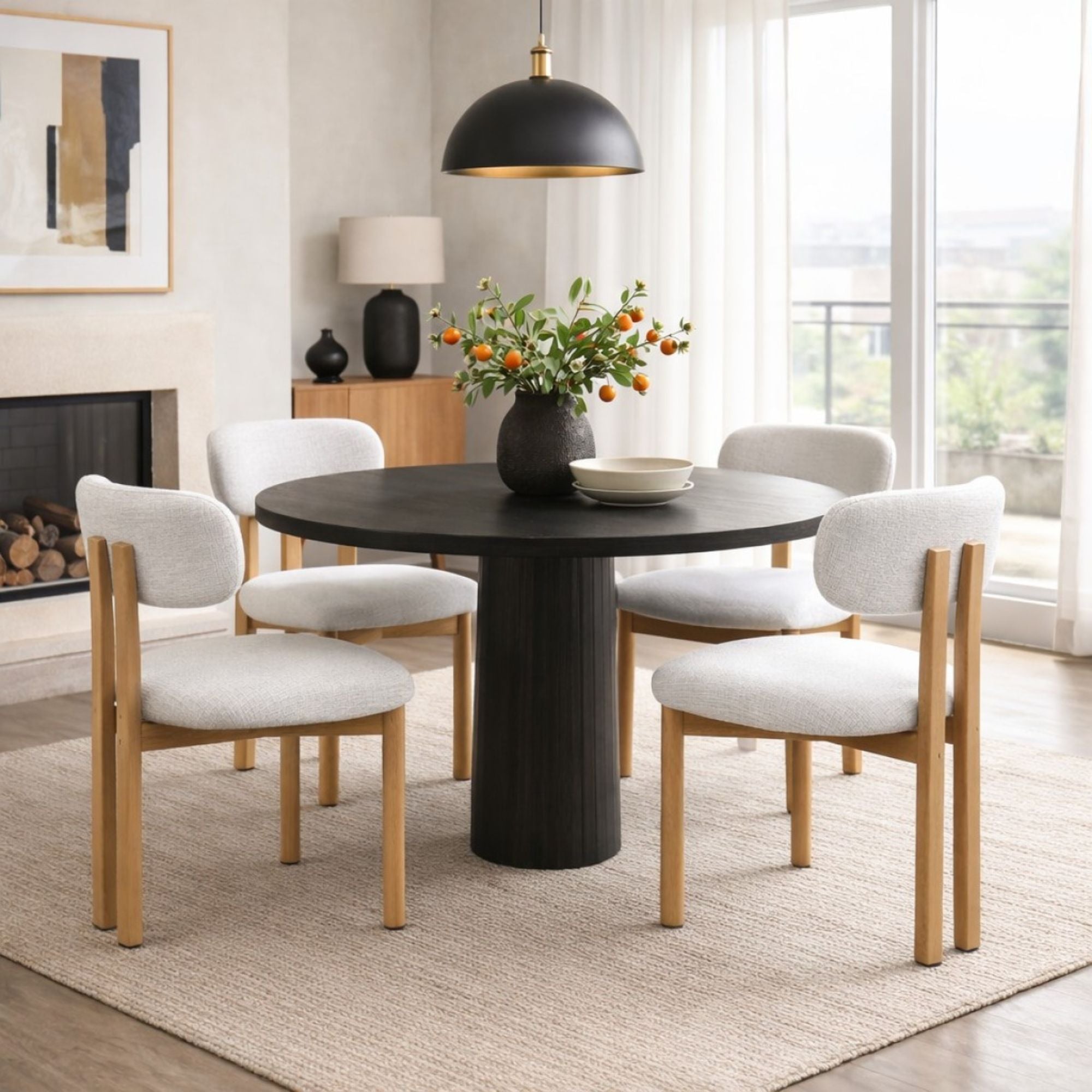 Pair of grey Brassex Milo dining chairs with sleek, modern design and cushioned seats, shown from a side angle.
