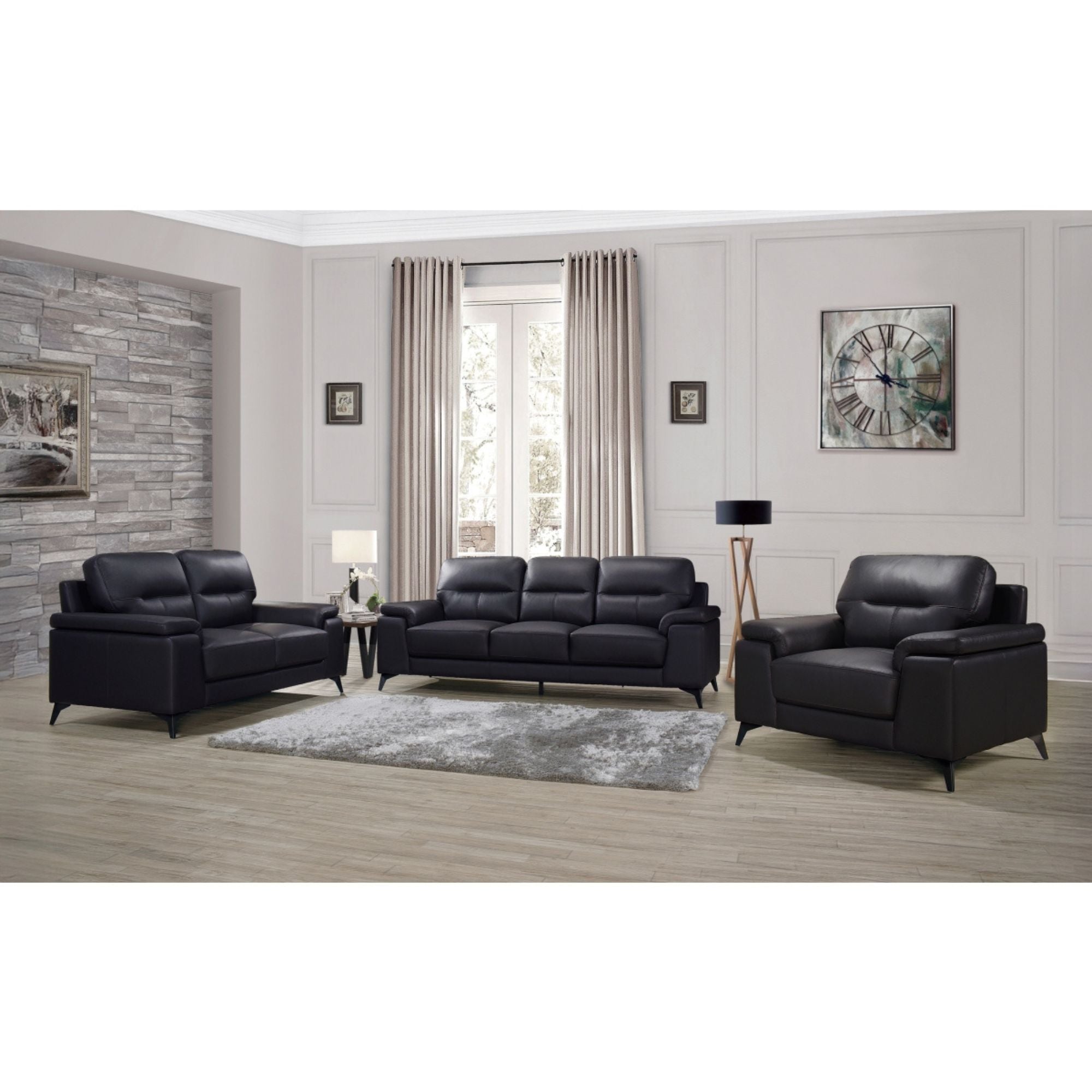 Black leather sofa from the MAZ Mischa Collection, featuring sleek design and plush seating for modern living rooms.