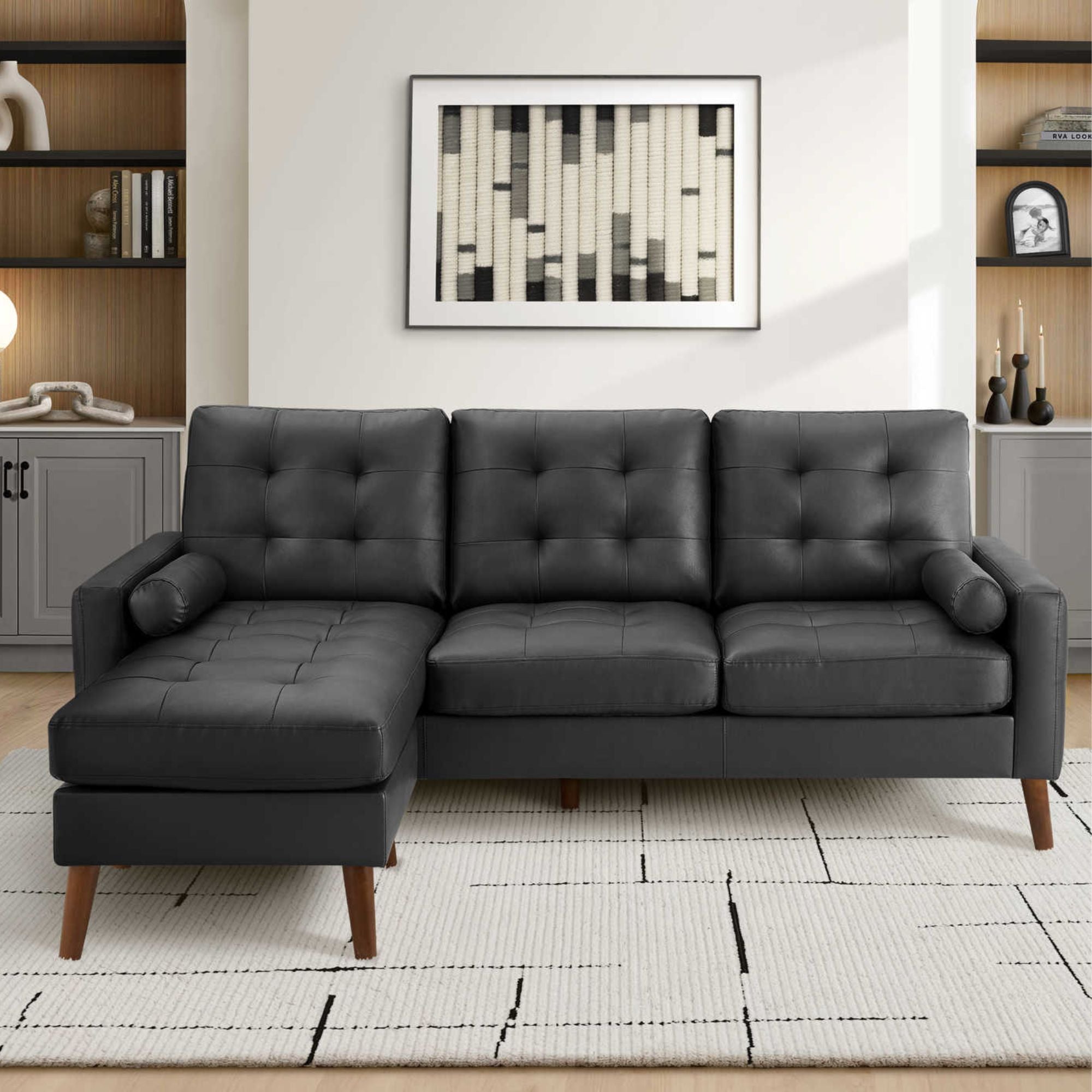 Monarch Specialties Monroe reversible sectional sofa in black PU leather with L-shaped configuration and plush cushions.