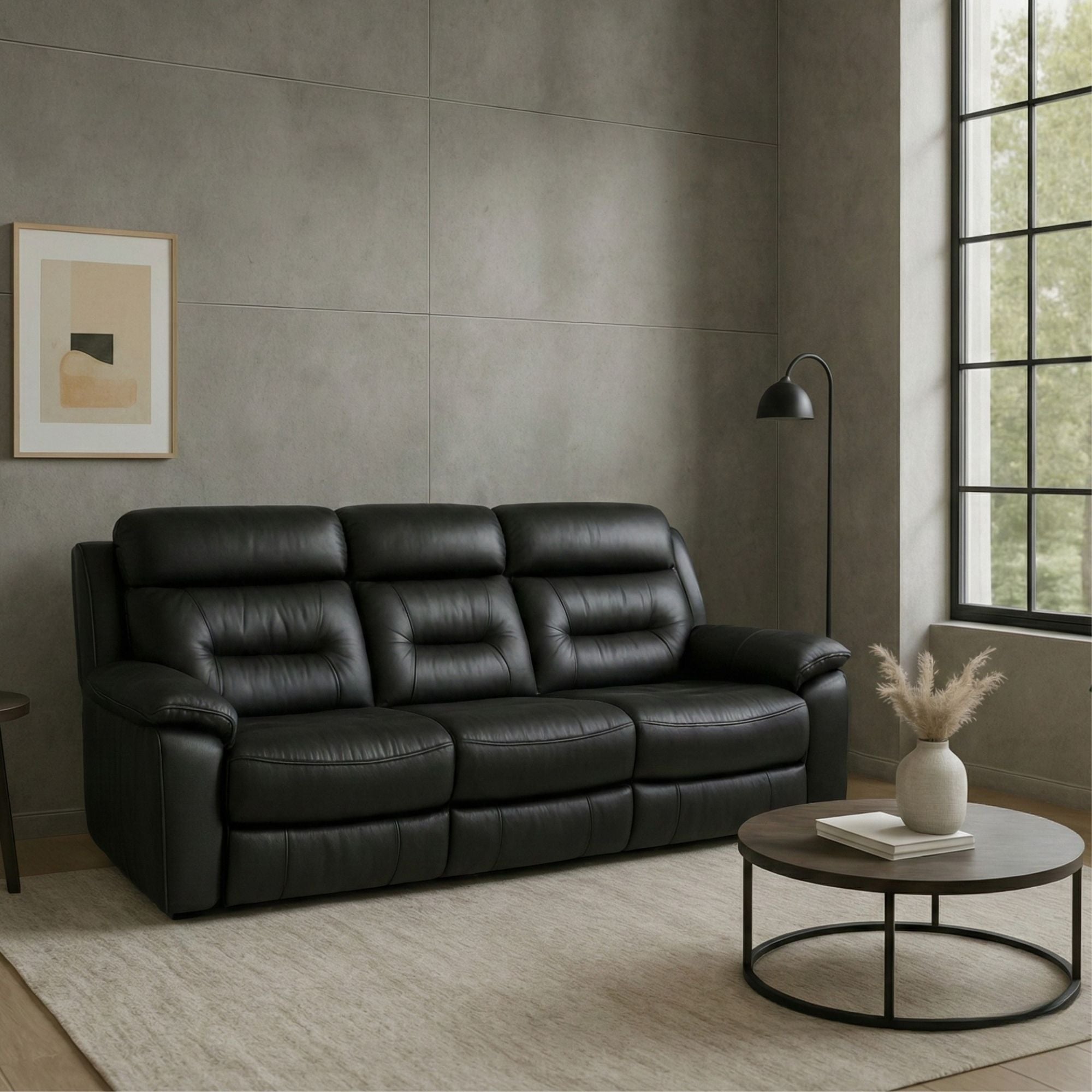 Black leather recliner sofa from Brassex, showcasing a comfortable reclining leather sofa with plush cushioning and modern design.