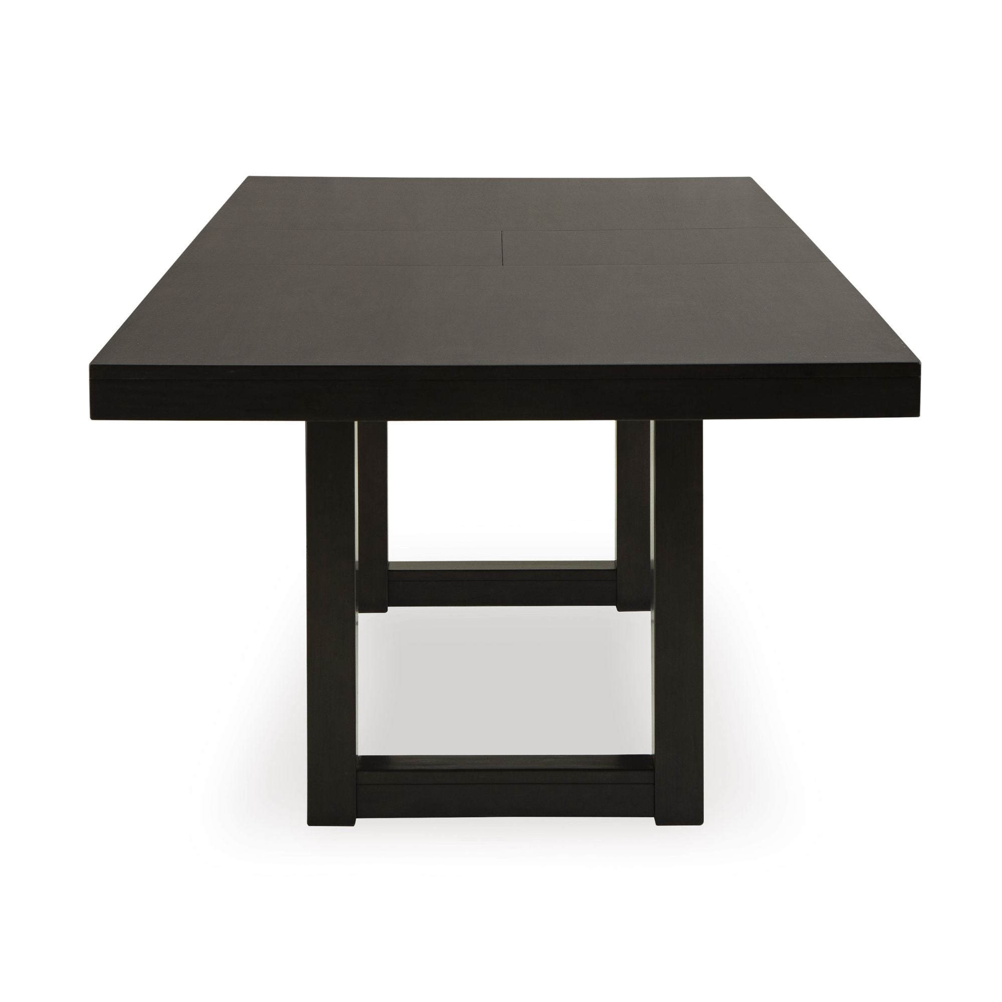 Neymorton dining extension table by Signature Ashley, showcasing a spacious wooden surface with extendable leaves for versatile dining.