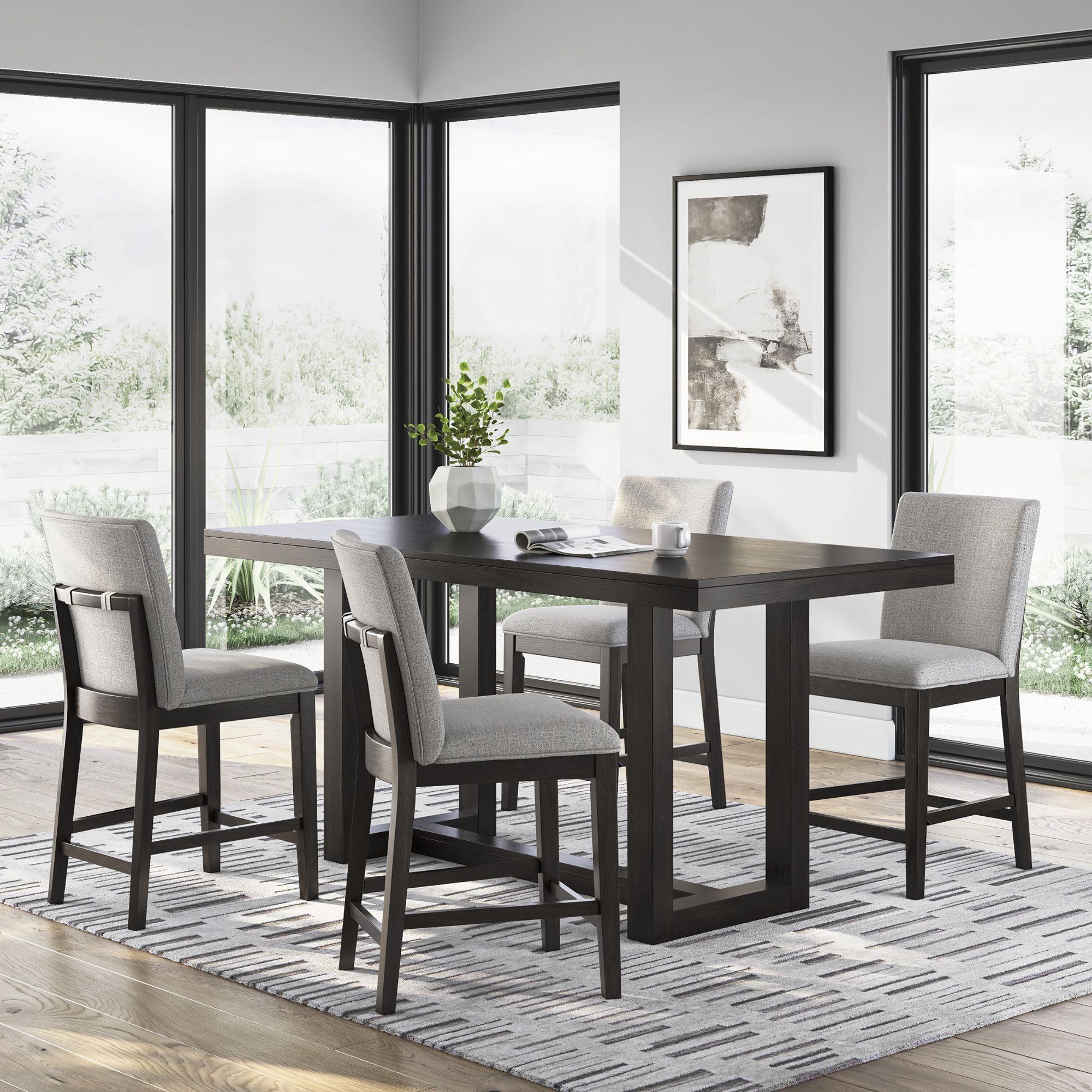 Signature Ashley Neymorton 5-piece round counter height dining room set with matching chairs and table in a modern design.