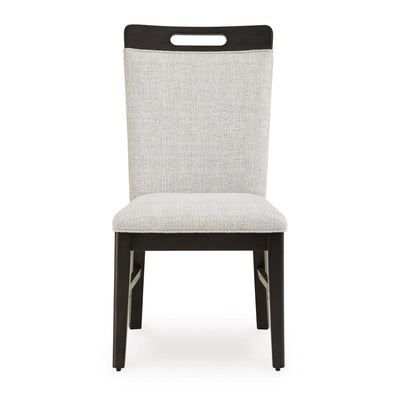 Set of two Ashley Neymorton Collection dining UPH side chairs with cushioned seats and elegant wooden legs in a modern dining room setting.