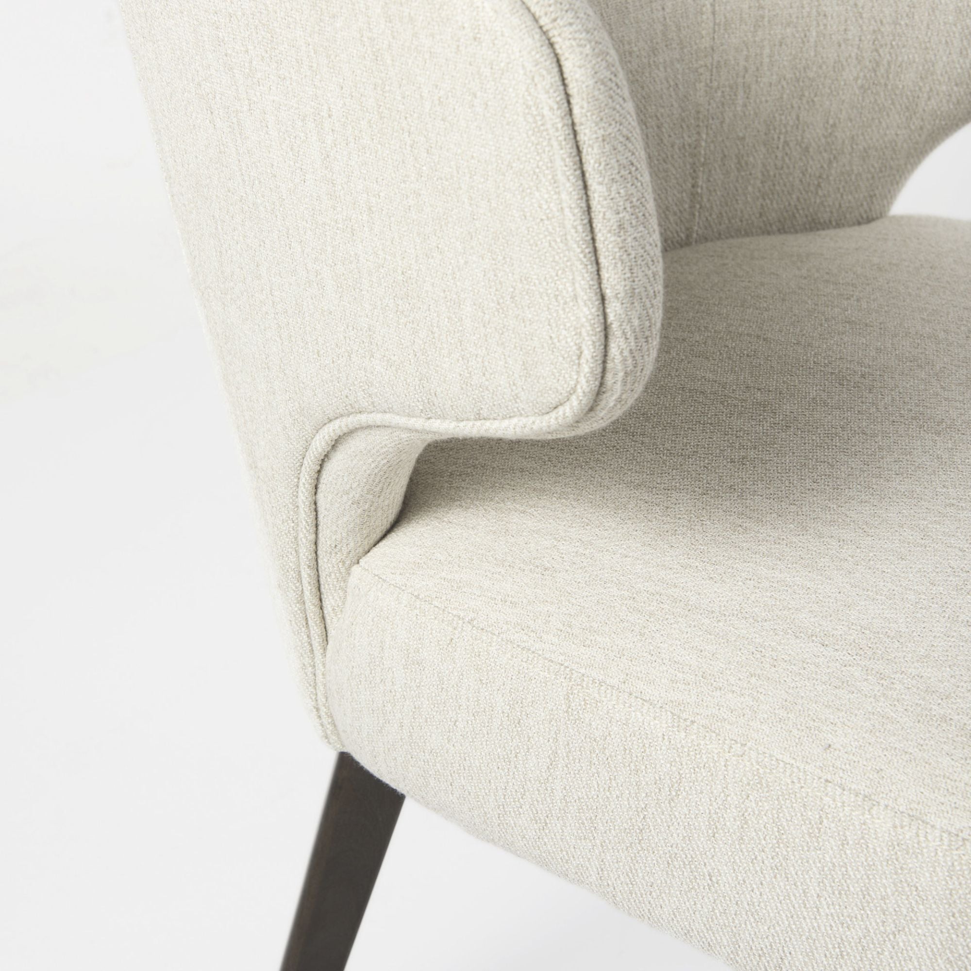 Dark brown Mercana Niles Fabric Dining Chair with cushioned seat and backrest, showcasing modern dining room style.