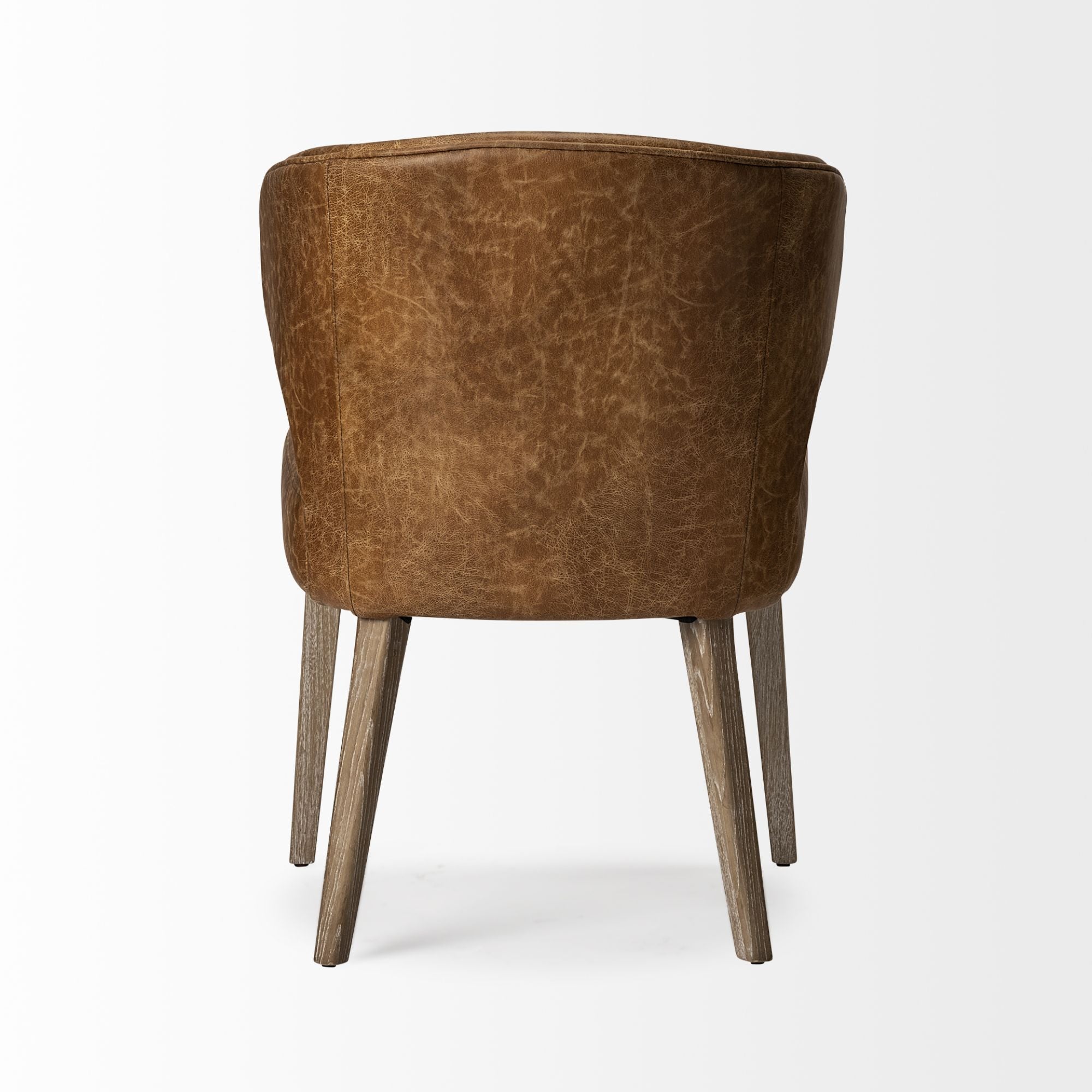 Mercana Furniture Niles faux leather dining chair with sleek design and cushioned seat, ideal for modern dining rooms.
