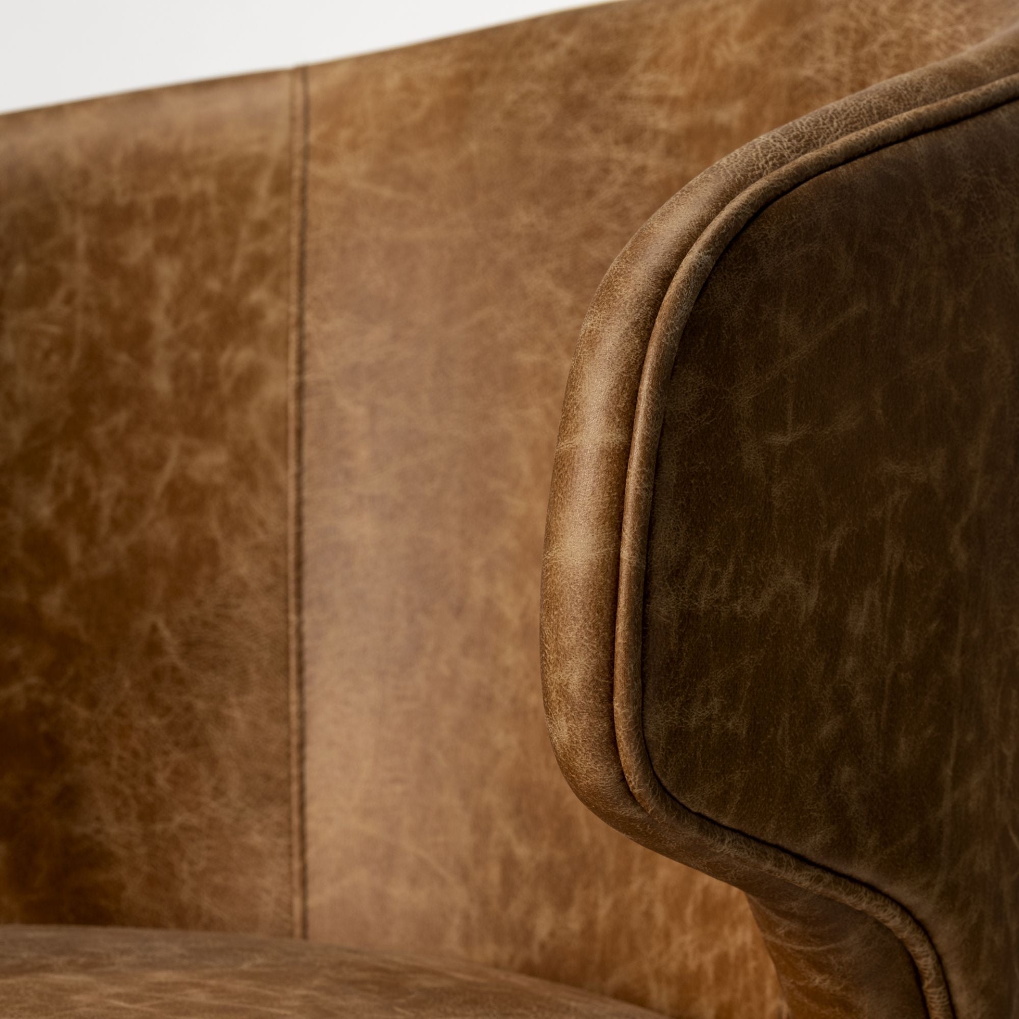 Mercana Furniture Niles faux leather dining chair with cushioned seat and modern design, perfect for contemporary dining rooms.