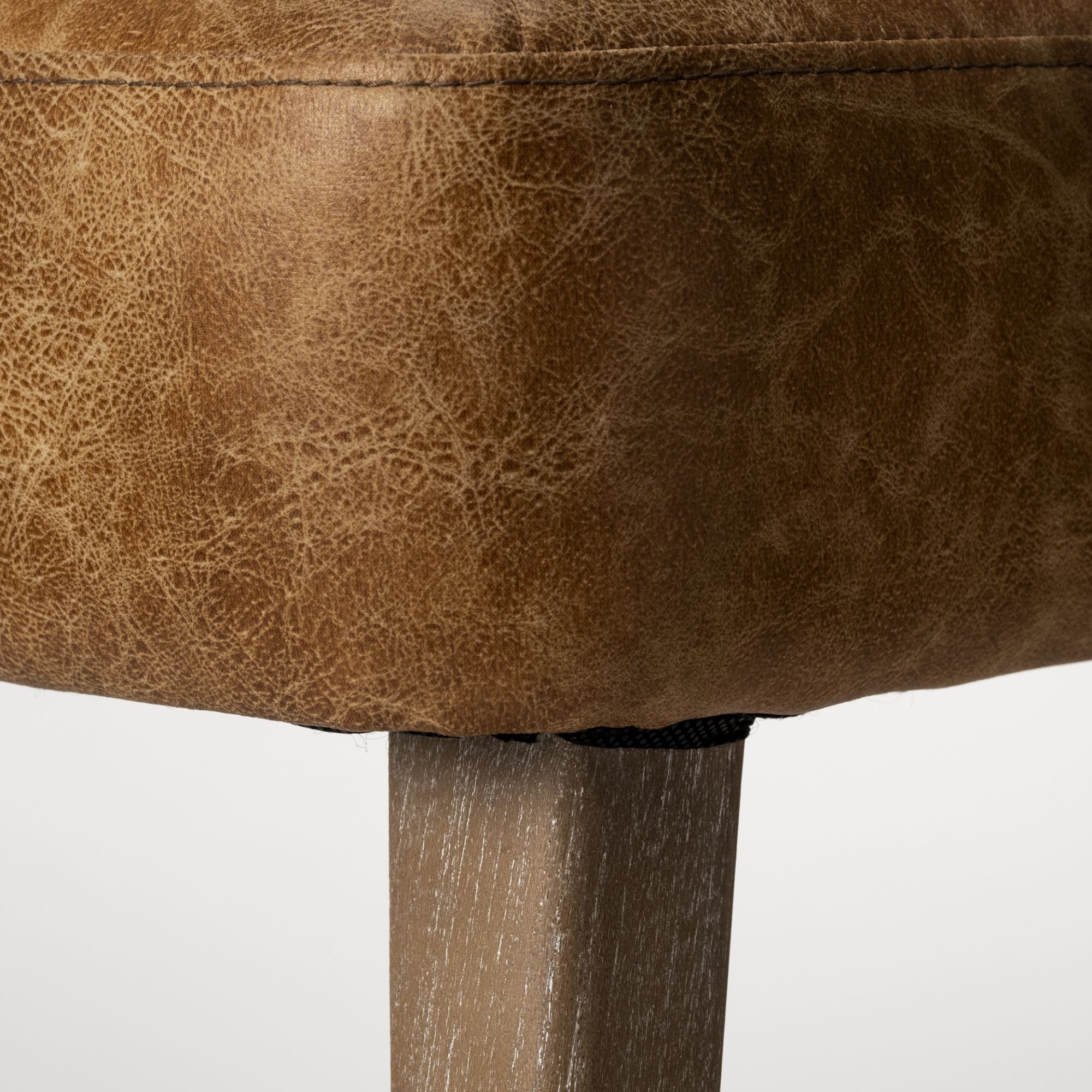 Mercana Furniture Niles faux leather dining chair with modern design and padded seat, ideal for contemporary dining rooms.