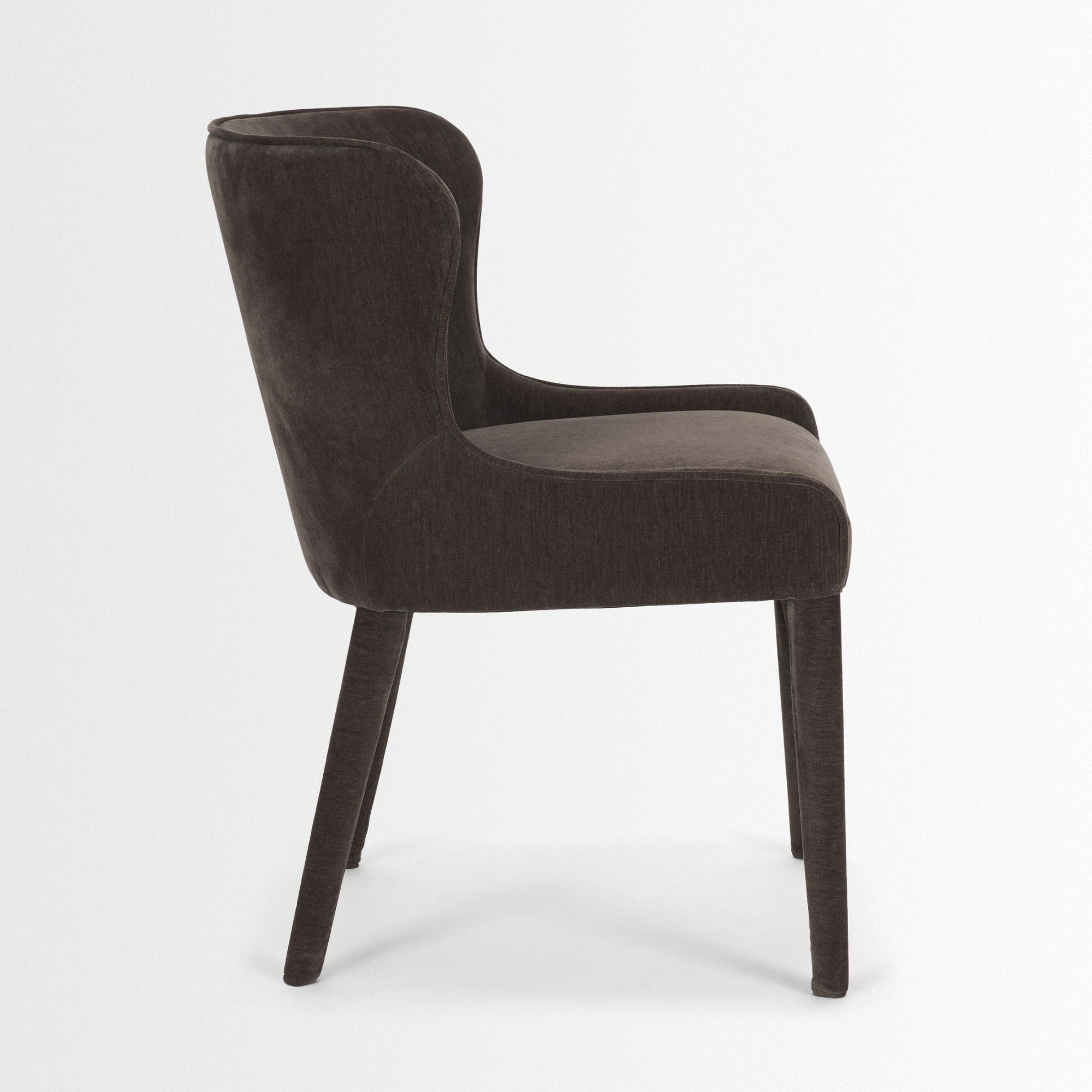 Mercana Furniture Nolan dining chair in cream chenille fabric, showcasing a modern design with wooden legs and plush upholstery.