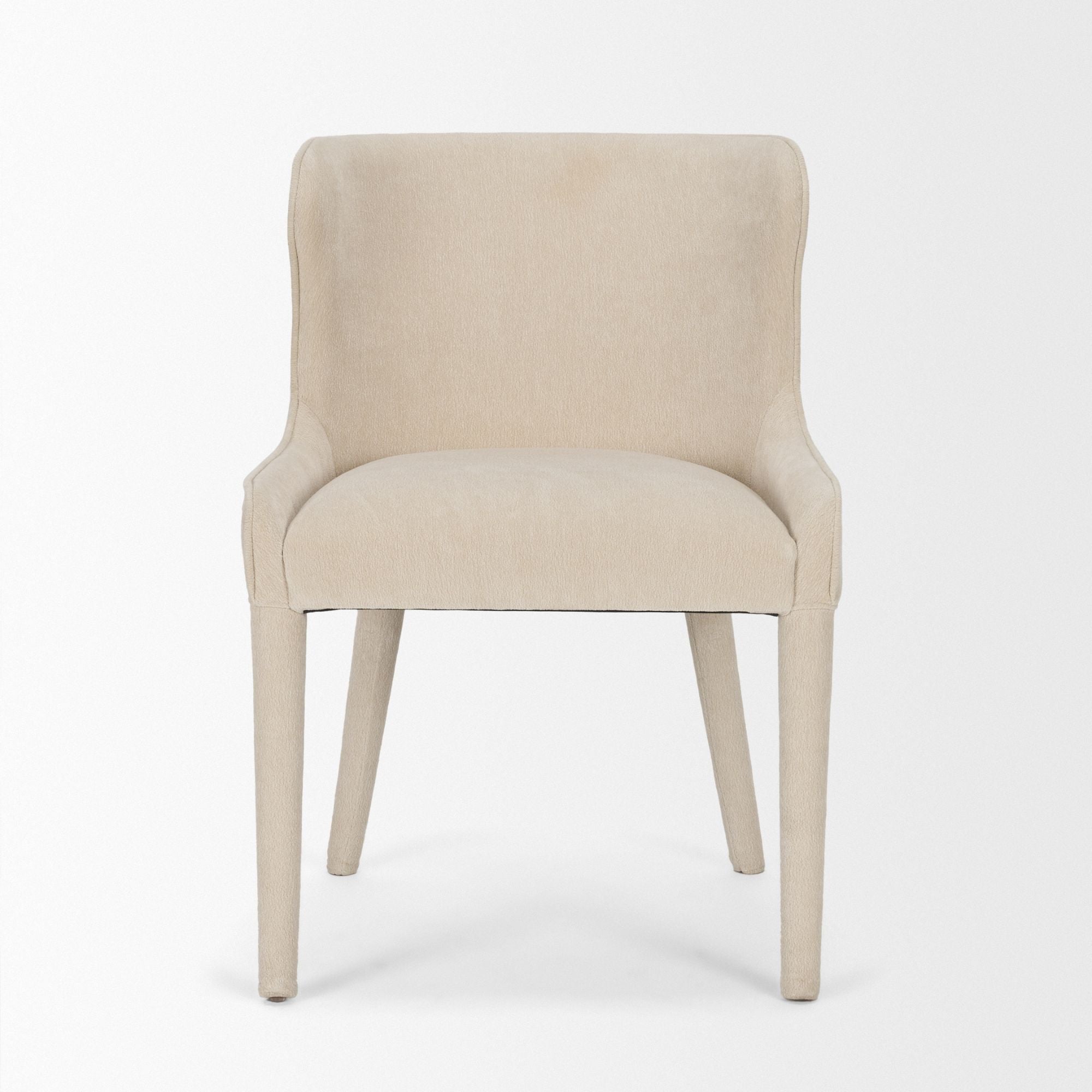 Cream chenille Nolan dining chair by Mercana Furniture, showcasing plush upholstery and wooden legs in a modern dining room setting.