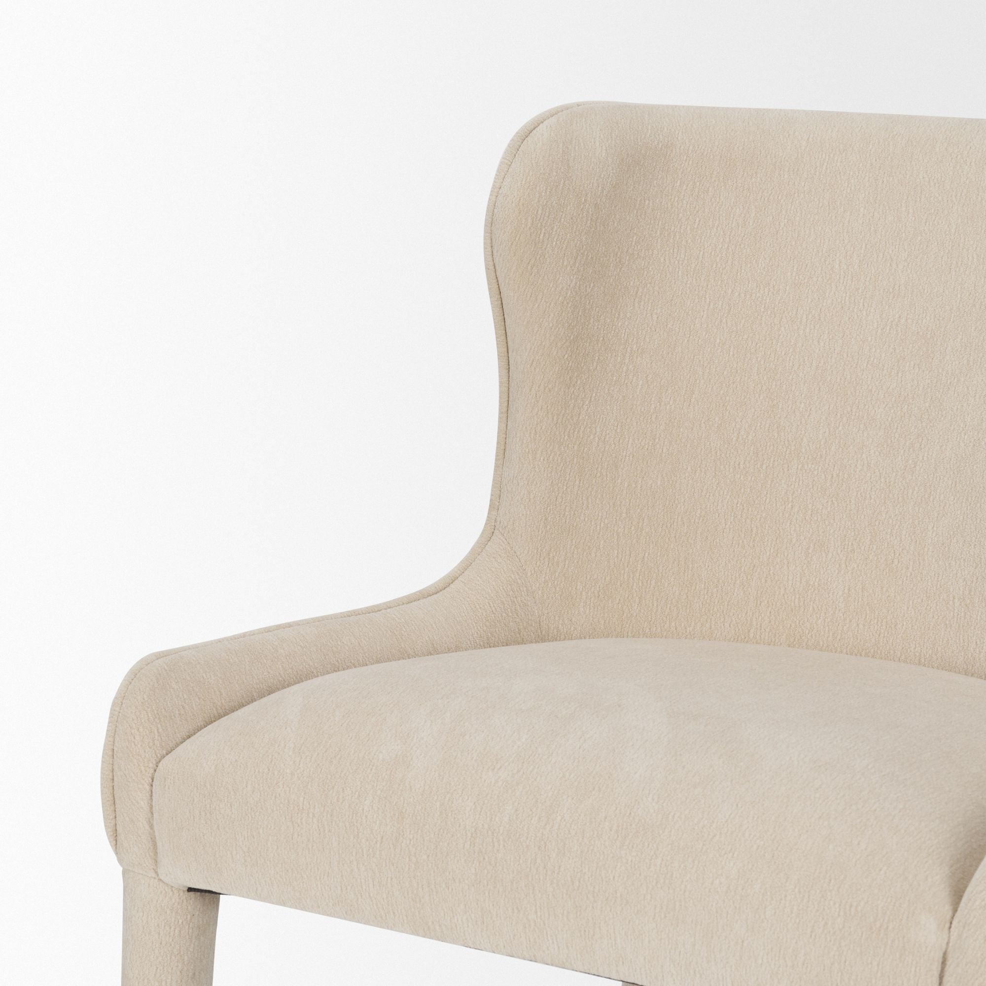 Cream chenille Nolan dining chair by Mercana Furniture with a modern design, featuring soft upholstery and wooden legs.