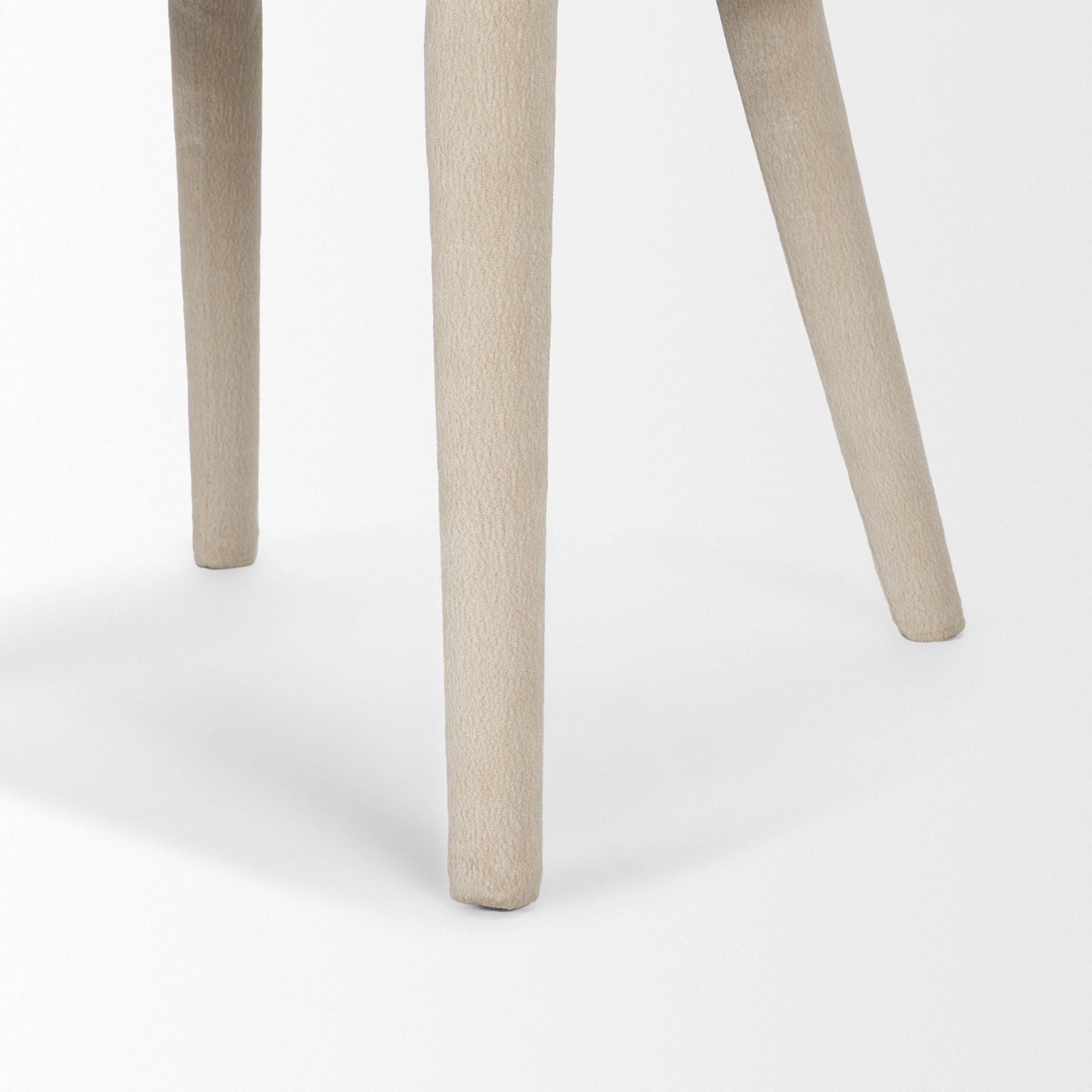 Cream chenille Nolan dining chair by Mercana Furniture with a modern, upholstered design and wooden legs.