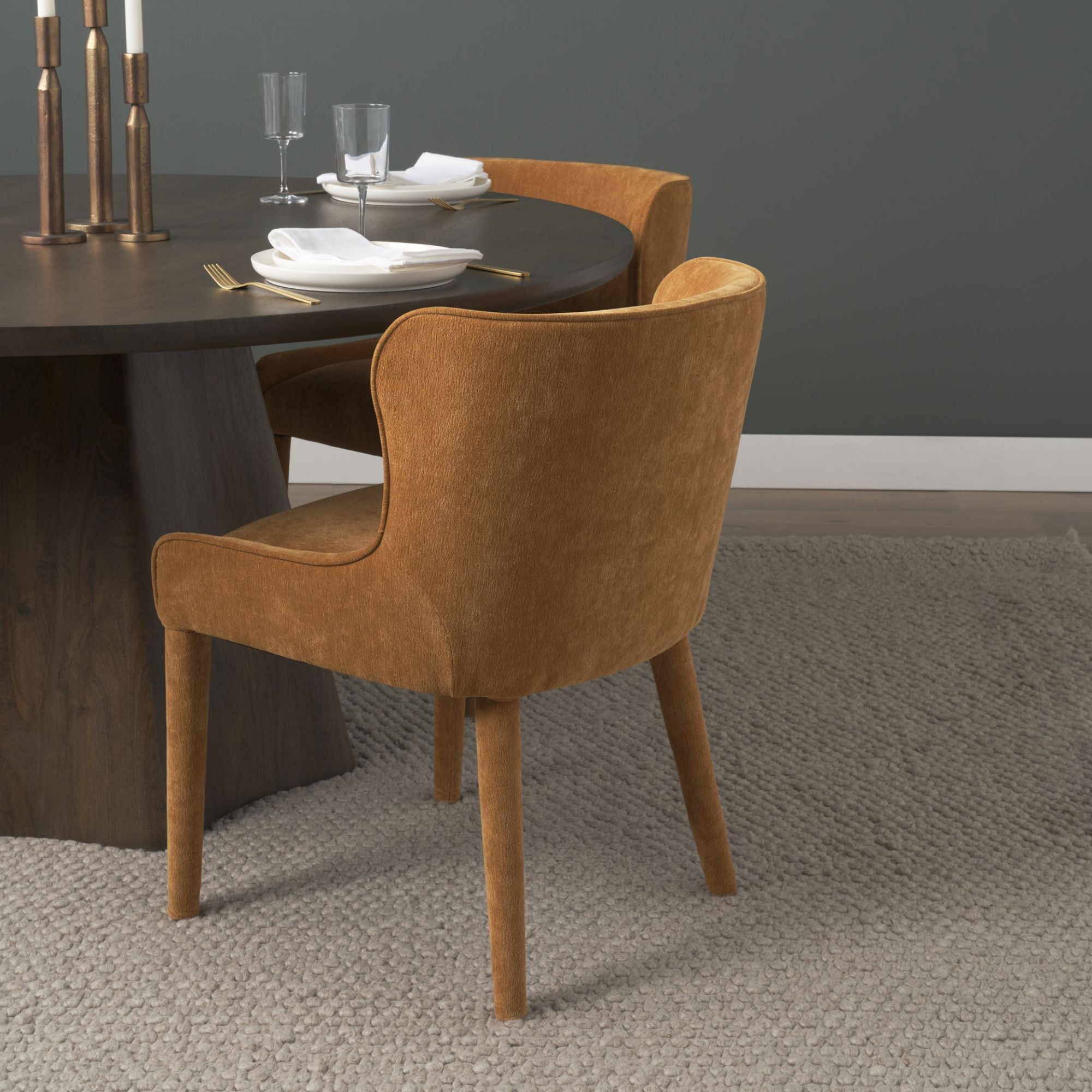 Cream chenille Nolan dining chair by Mercana Furniture with a modern design and wooden legs.