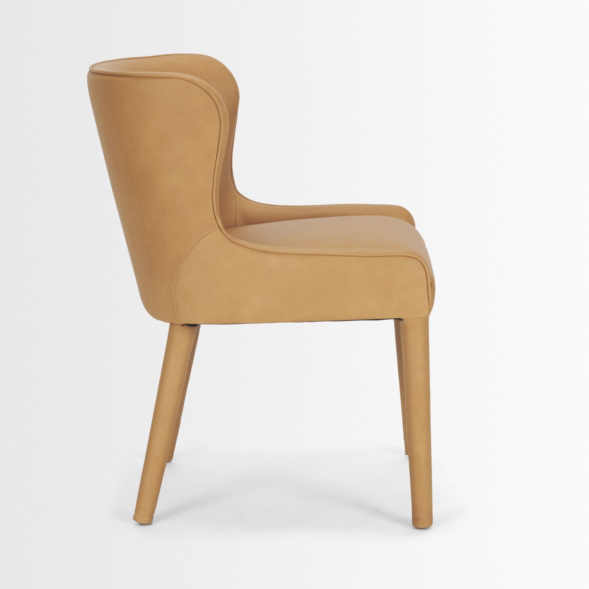 Mercana Furniture Nolan leather dining chair with cushioned seat and sleek wooden legs, ideal for modern dining rooms.