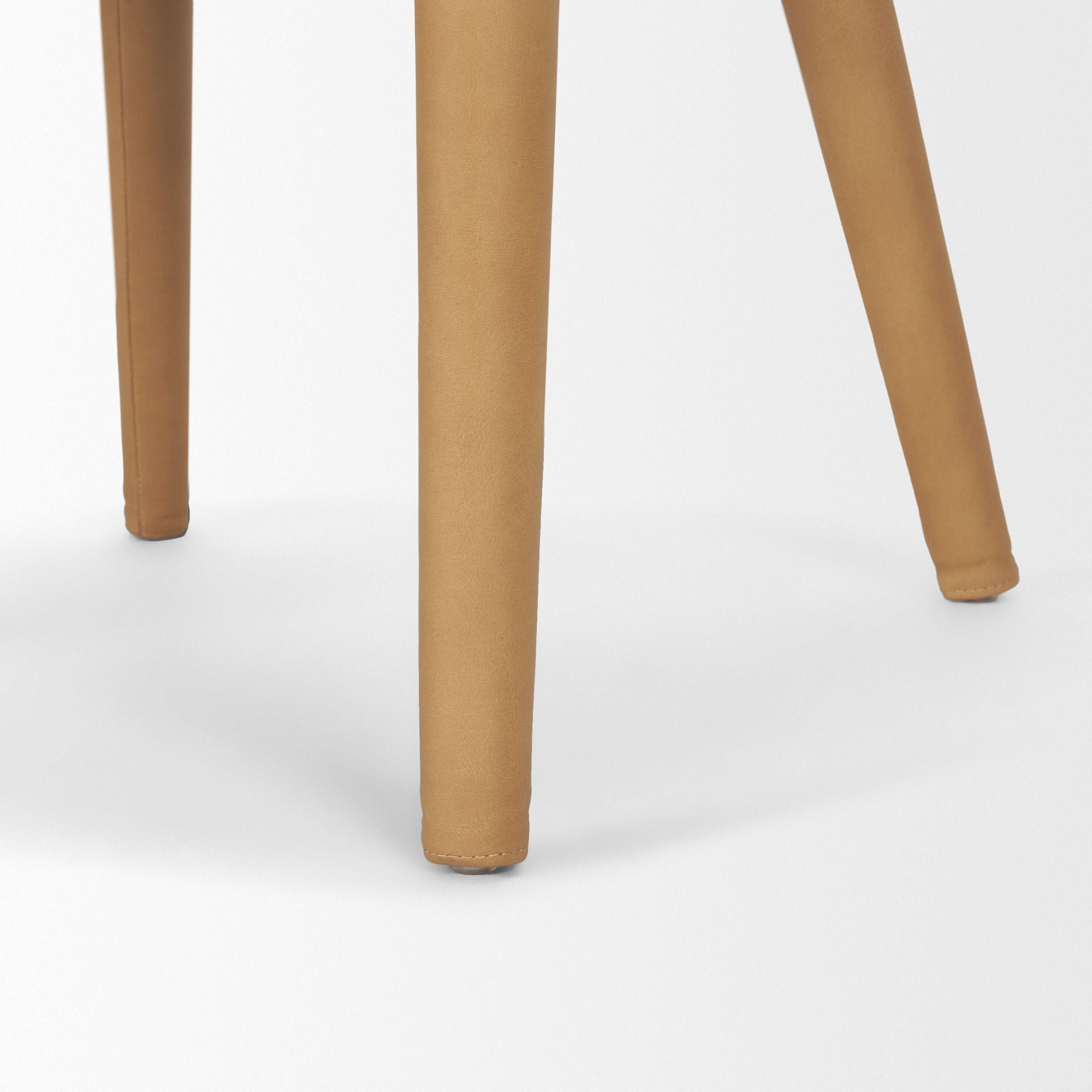 Mercana Furniture Nolan leather dining chair with sleek design and cushioned seat, ideal for modern dining rooms.