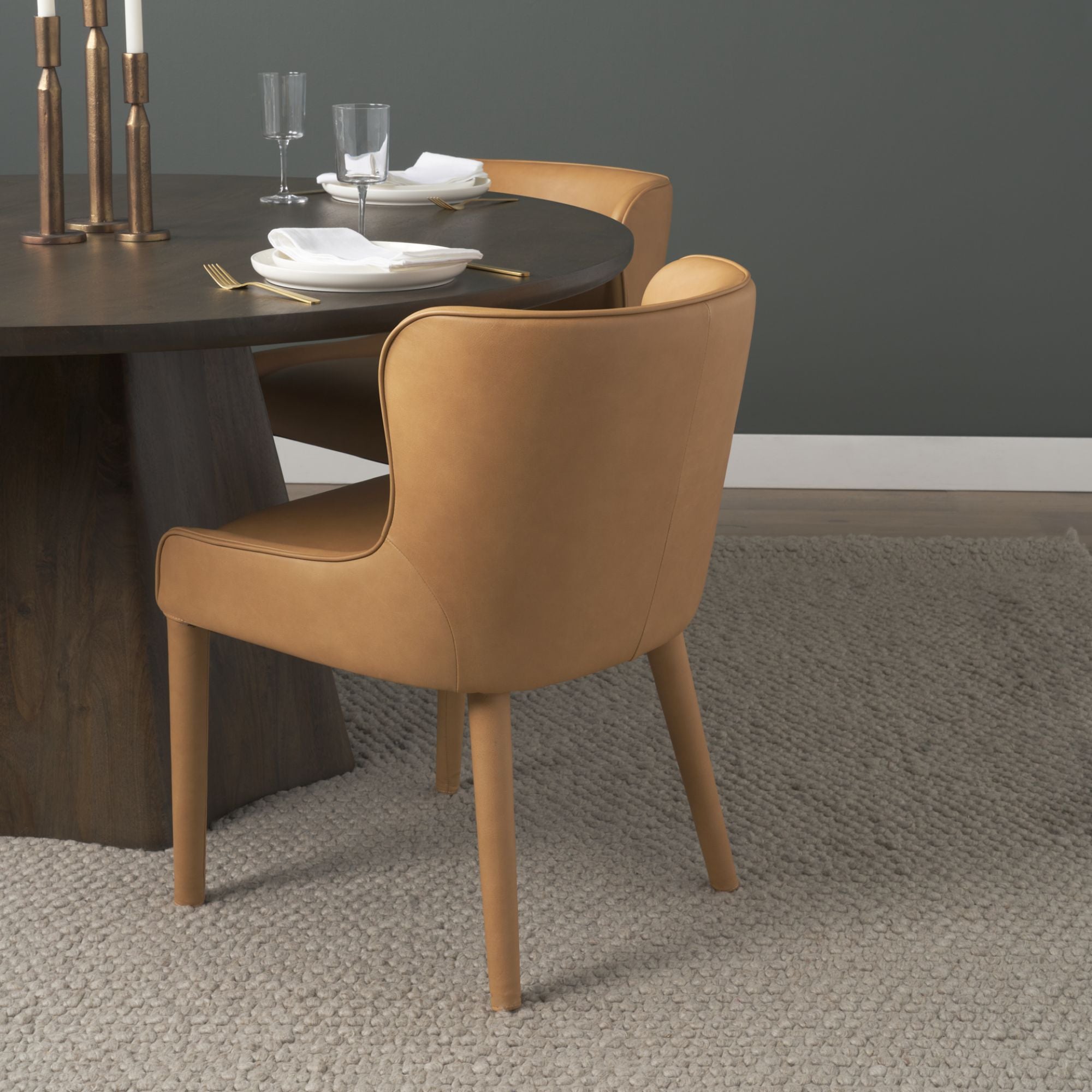 Mercana Furniture Nolan leather dining chair with sleek design, cushioned seat, and modern style for elegant dining settings.