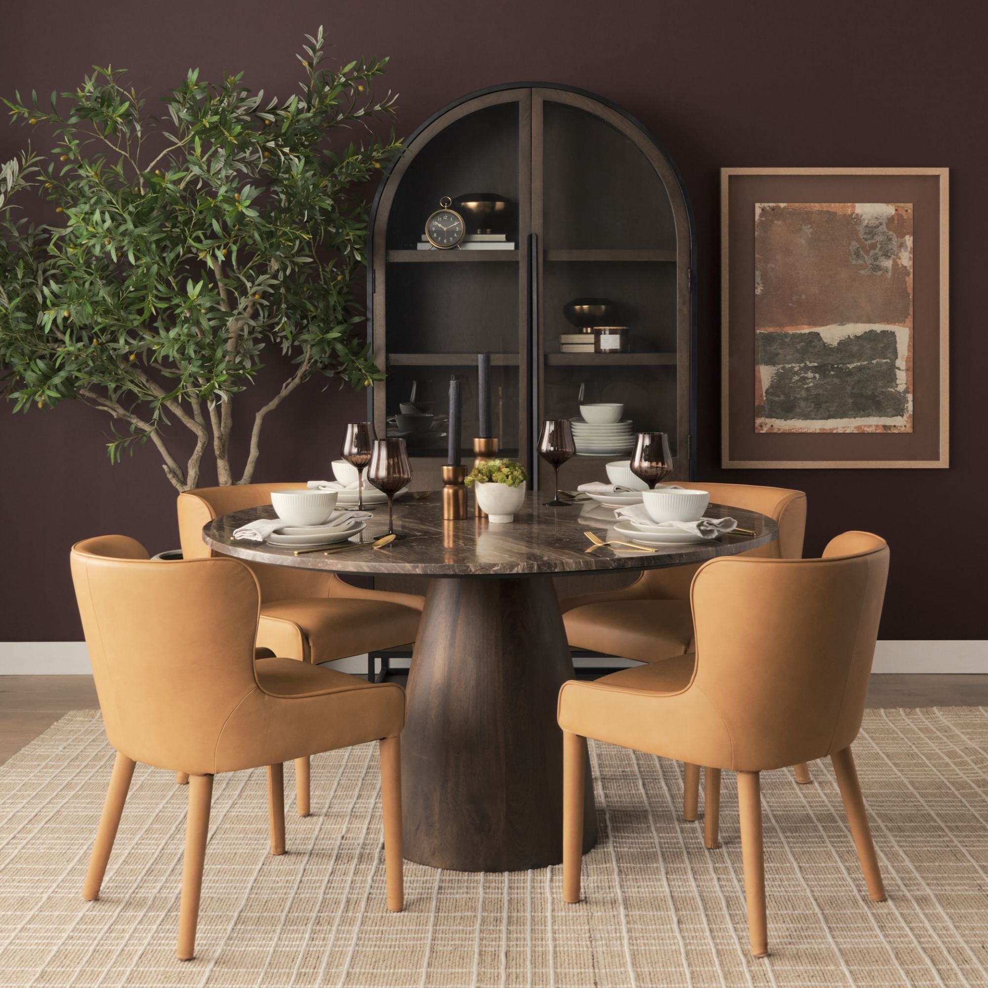 Mercana Furniture Nolan leather dining chair with sleek design, featuring a cushioned seat and stylish wooden legs.