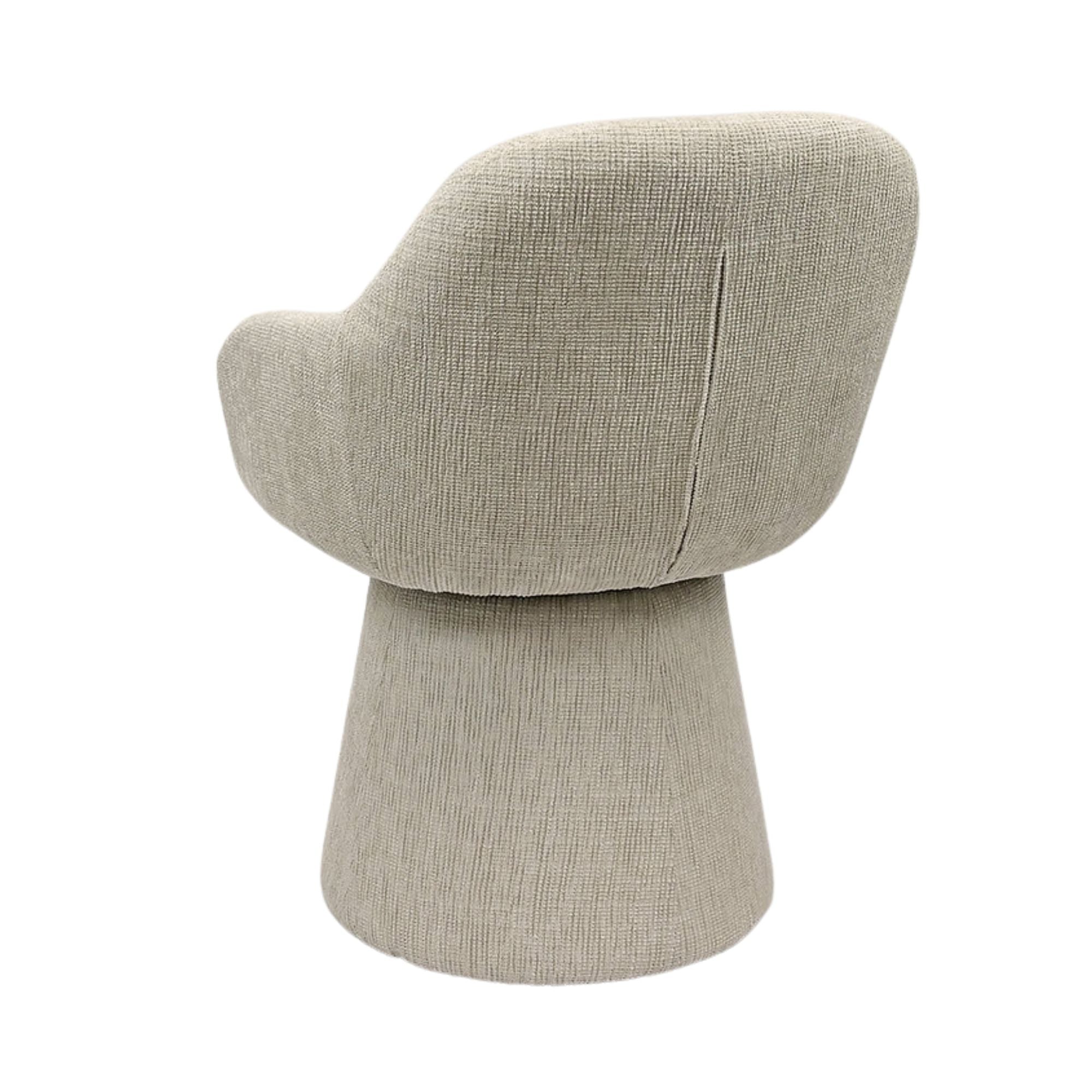 Beige Nora swivel dining chair by Elite Living with padded seat and backrest, modern design, shown from side view.