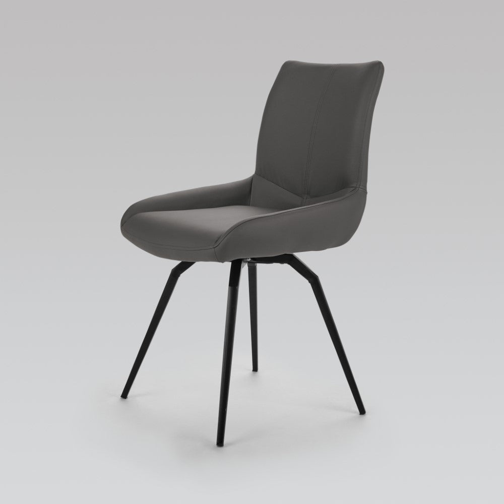Set of two Xcella Nona swivel dining chairs with grey PU upholstery, featuring modern design and comfortable seating.