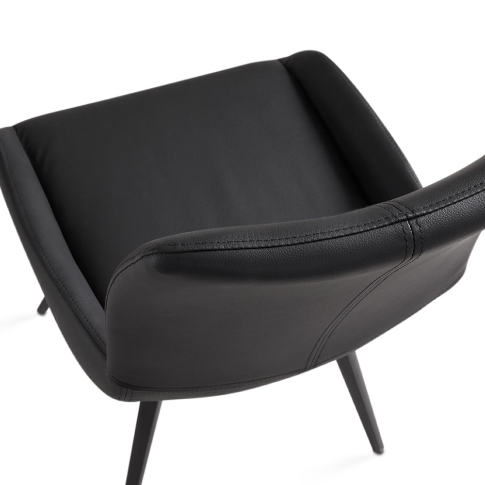 Set of two Xcella Nona swivel dining chairs with modern design and cushioned seats, shown from a side angle in Norman_Chair_3.jpg.