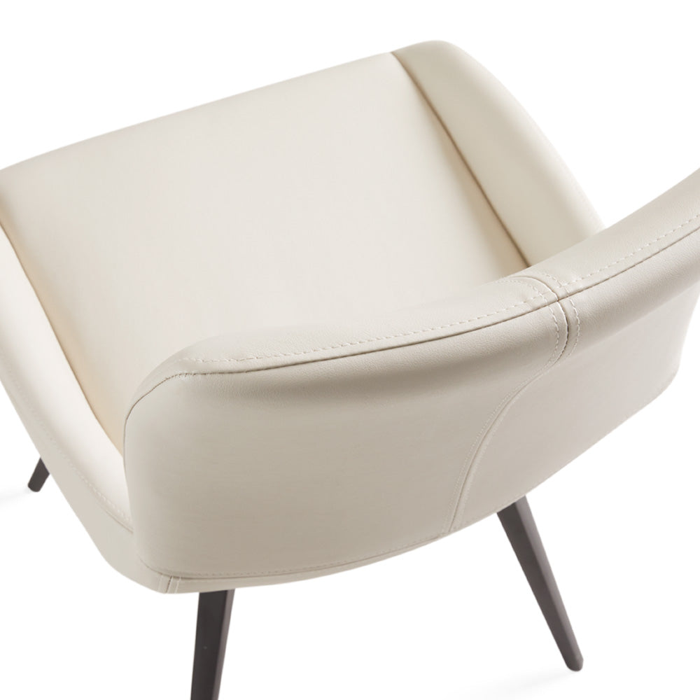 Pair of Xcella Nona swivel dining chairs with modern design, featuring cushioned seats and sleek wooden legs.