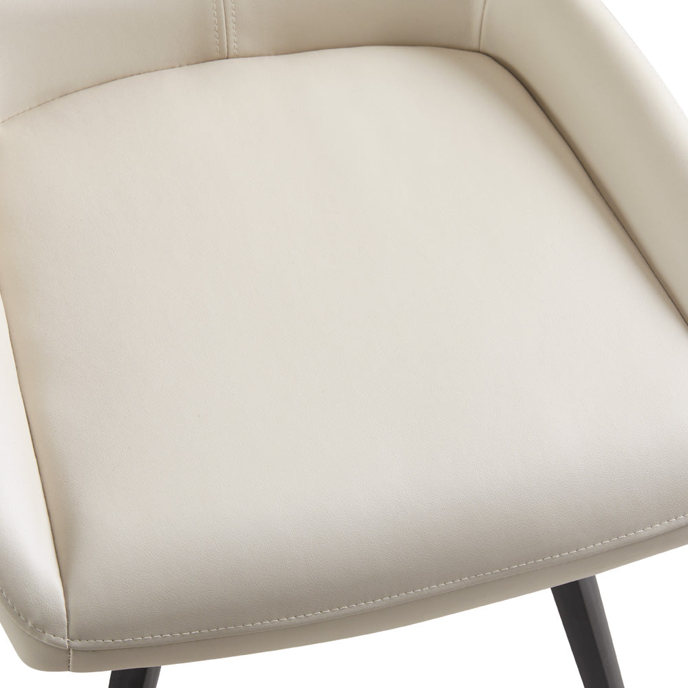 Two Xcella Nona swivel dining chairs with modern design, featuring plush upholstery and wooden legs, set against a neutral background.