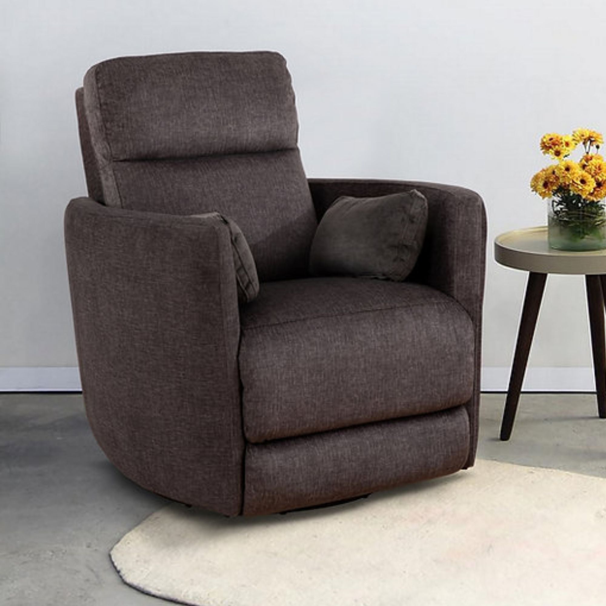 Brown Nova swivel recliner chair by IFF with plush upholstery and a modern design, featuring a comfortable recline and swivel function.