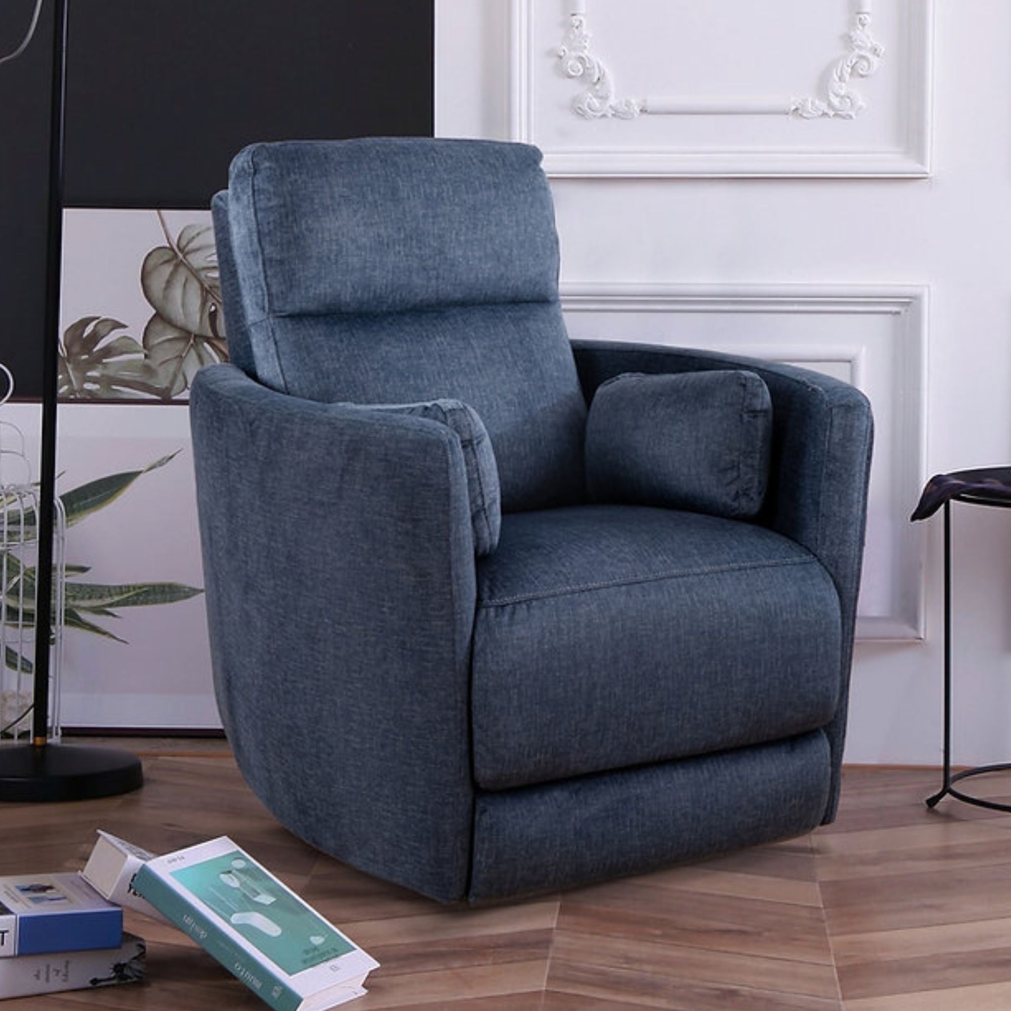 Blue Nova swivel recliner chair by IFF with plush upholstery and modern design, shown in a comfortable reclining position.