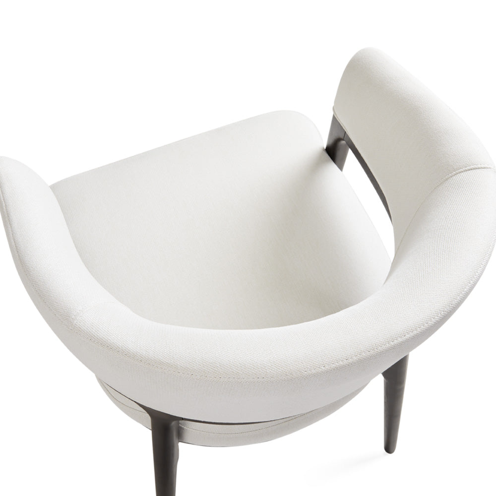 White Erica dining chair by Xcella featuring a modern design, shown from a side angle on a neutral background.