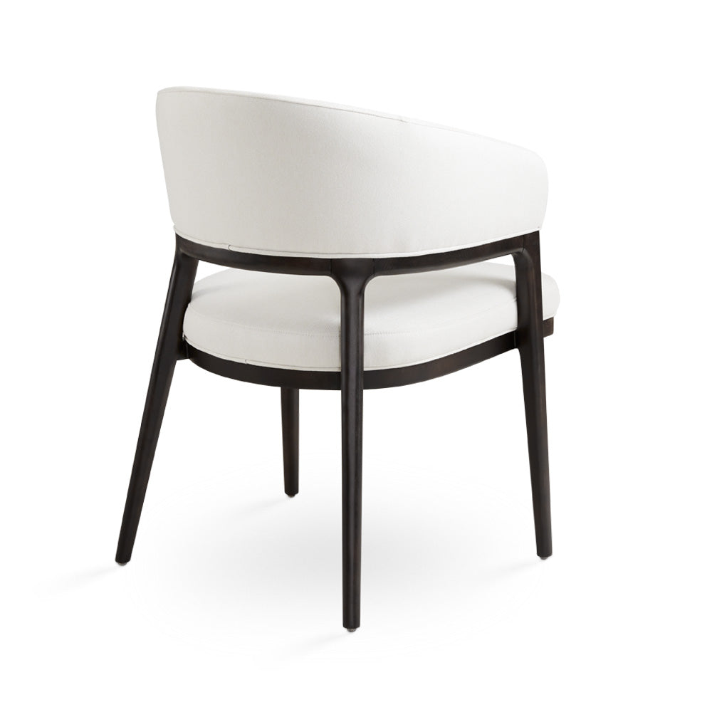 White Erica dining chair by Xcella, showing the back three-quarter view of a modern kitchen and dining room chair.
