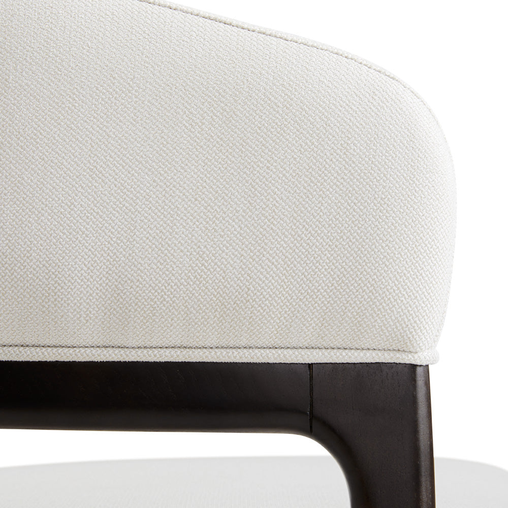 Xcella Erica white dining chair with sleek modern design, featuring a comfortable cushioned seat and wooden legs for kitchen or dining room.