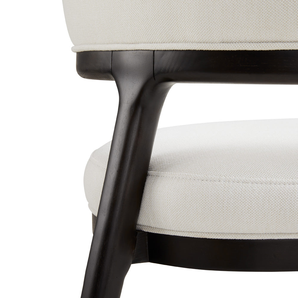 Xcella Erica dining chair in white with sleek modern design, featuring a comfortable upholstered seat and wooden legs.