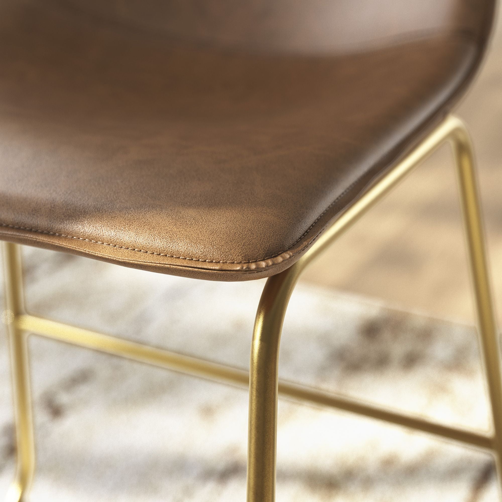 Set of two Signature Ashley Ciabori UPH dining chairs in brown and gold with sleek modern design.