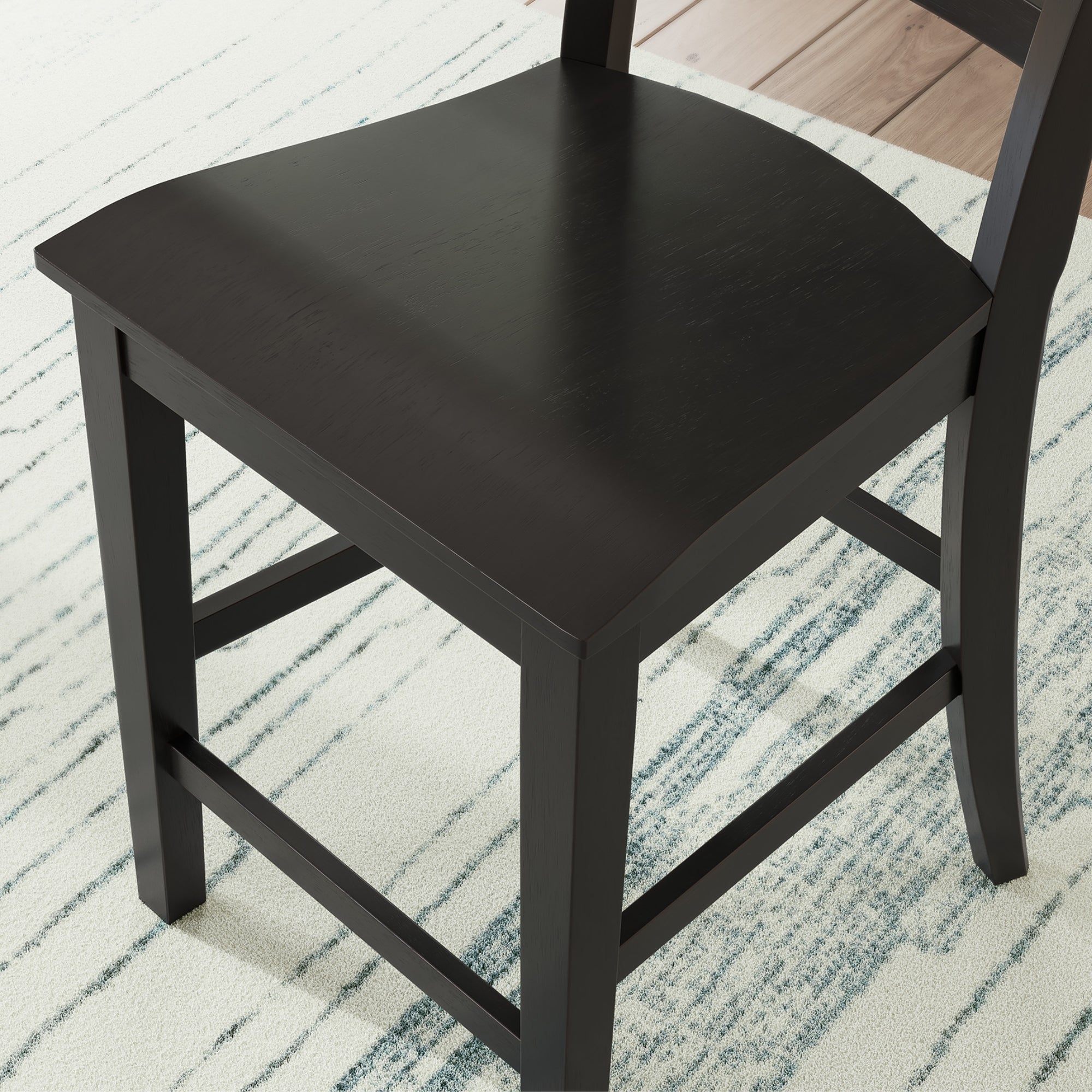 Set of two black Greddinton barstools by Signature Ashley, featuring modern design and sturdy wooden legs.