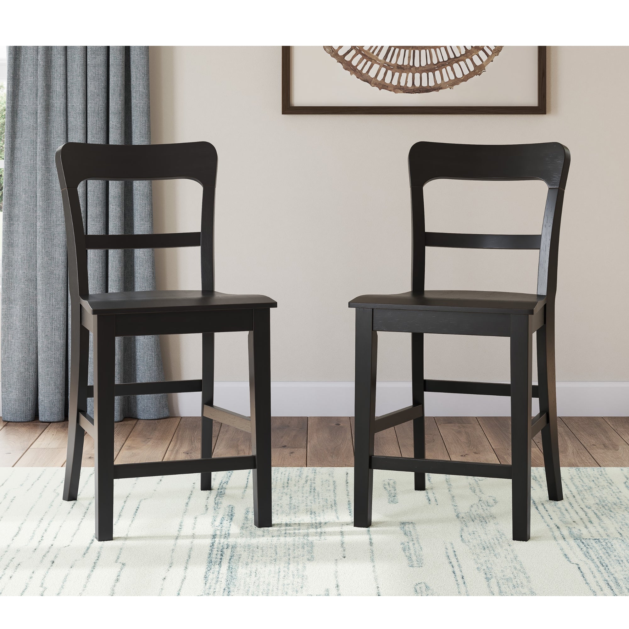 Two black Greddinton barstools from Signature Ashley with wooden legs and backrests, designed for modern kitchen or bar area.