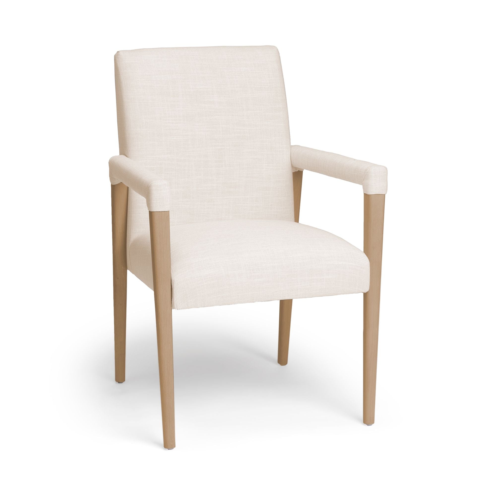 Cream Mercana Palisades Dining Armchair with wooden legs, featuring plush cushioned seat and elegant armrests.