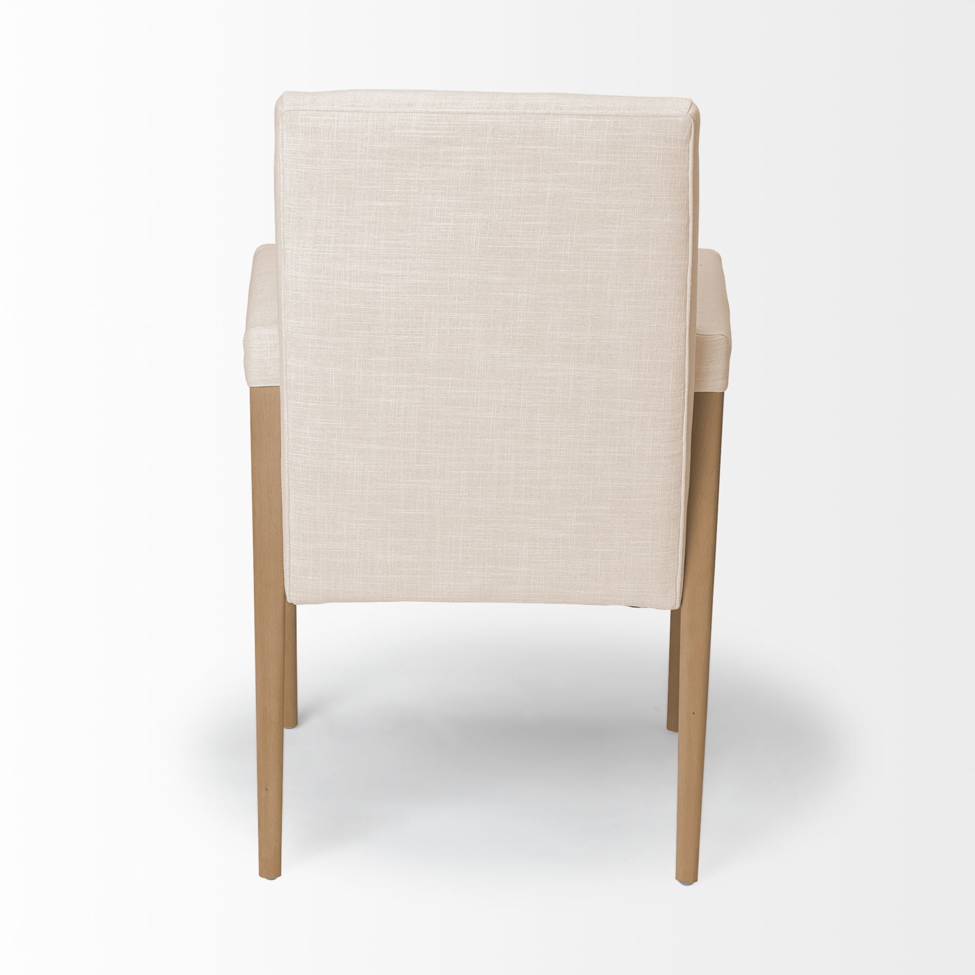 Cream-colored Mercana Palisades Dining Armchair with wooden legs, stylish and comfortable for modern dining rooms.
