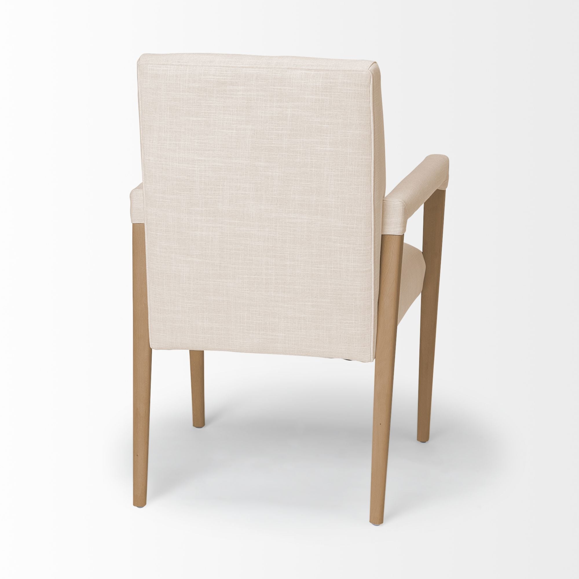 Cream Mercana Palisades Dining Armchair with wooden legs and cushioned seat, showcasing elegant design and comfortable seating.