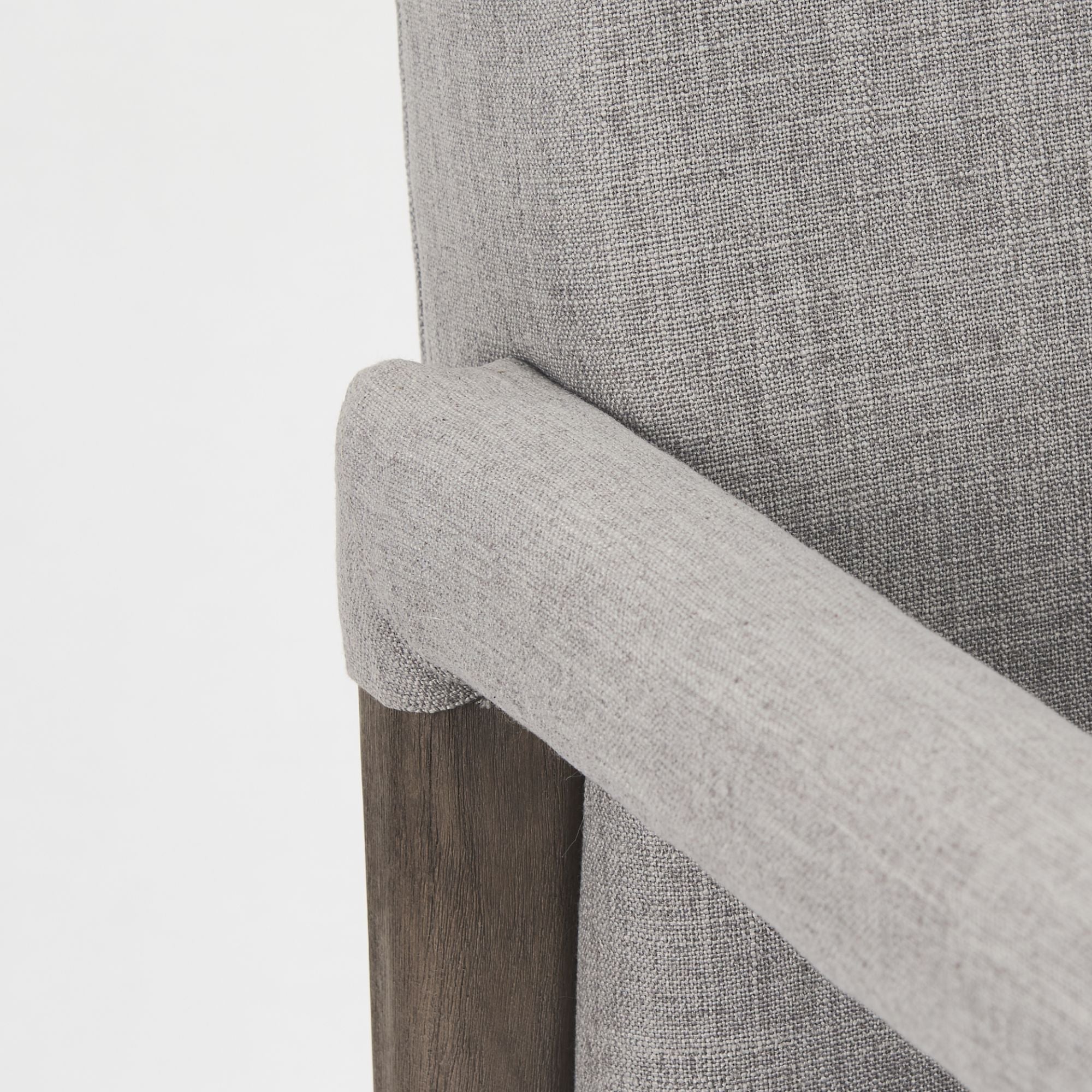 Gray Mercana Palisades Dining Armchair with wooden legs and cushioned seat, showcasing a modern, comfortable dining chair design.