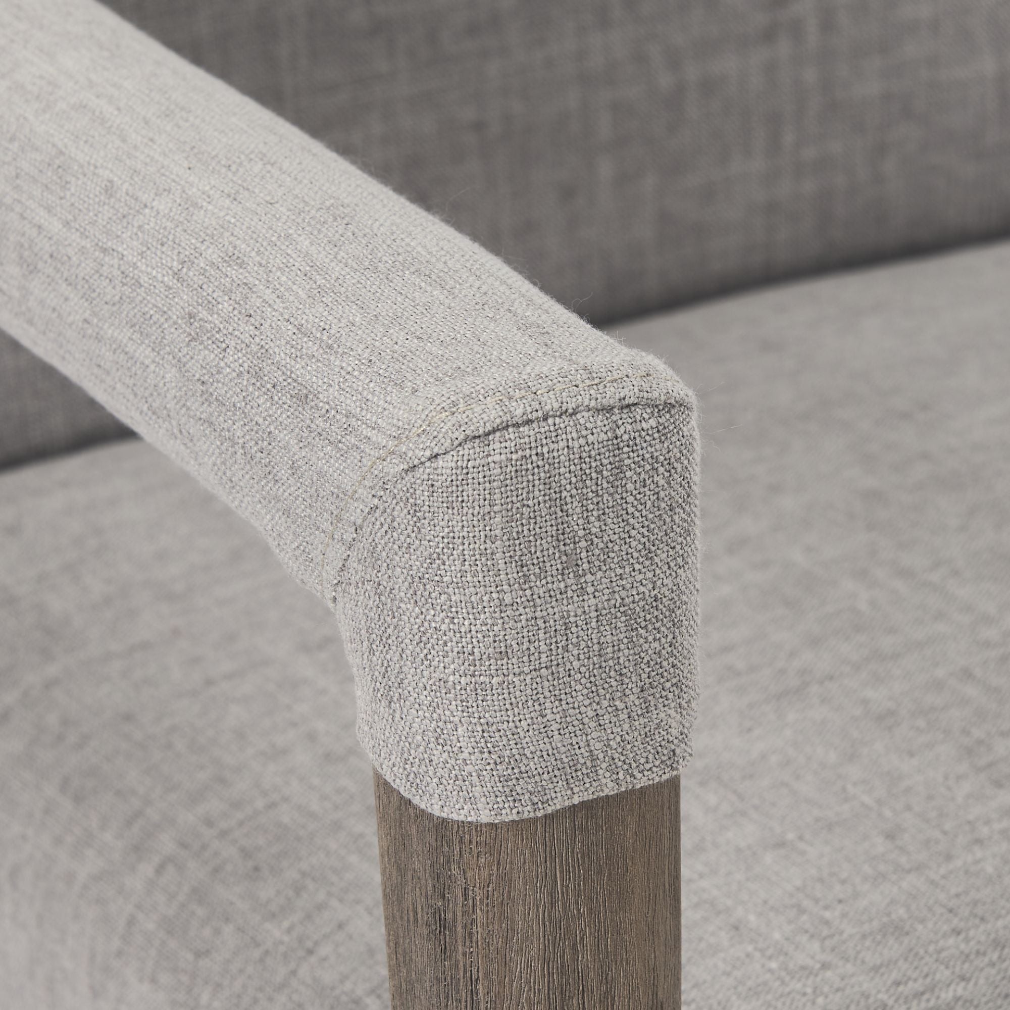 Gray Mercana Palisades Dining Armchair with wooden legs, featuring a plush upholstered seat and backrest for comfortable dining.